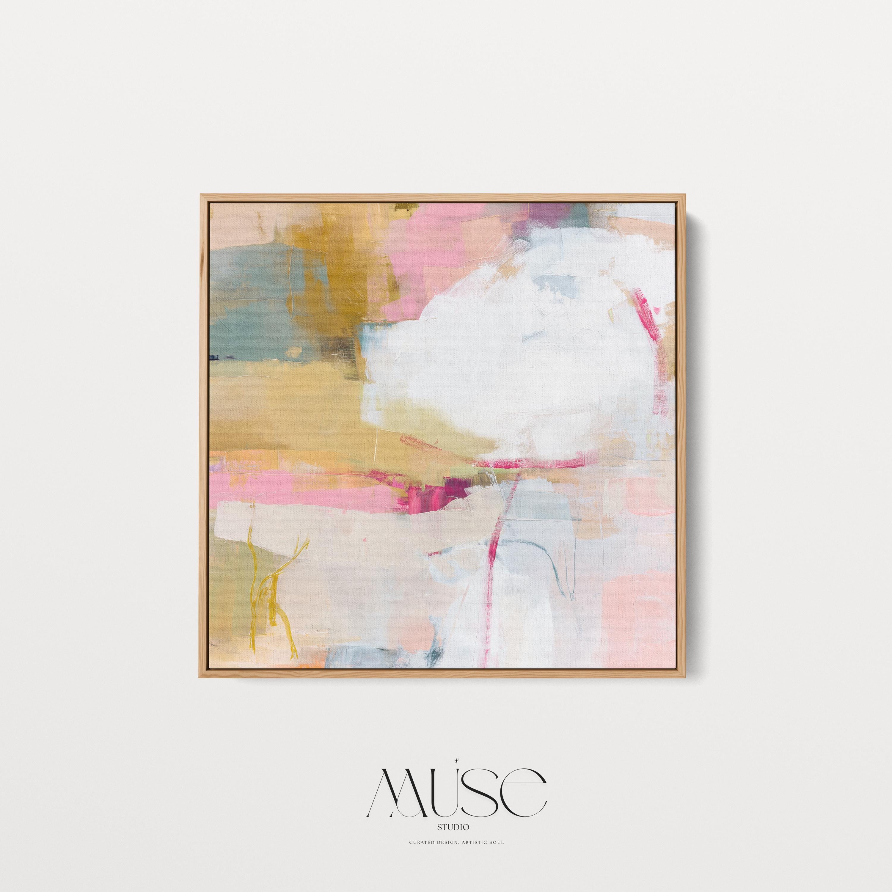 Square abstract wall art in soft pink, mustard, white, and teal tones framed in natural wood and displayed on a clean white wall. Light pastel contemporary artwork with gentle brushwork, ideal for modern living rooms, bedrooms, or designer interiors. Available as framed canvas or giclée print by Muse Studio.