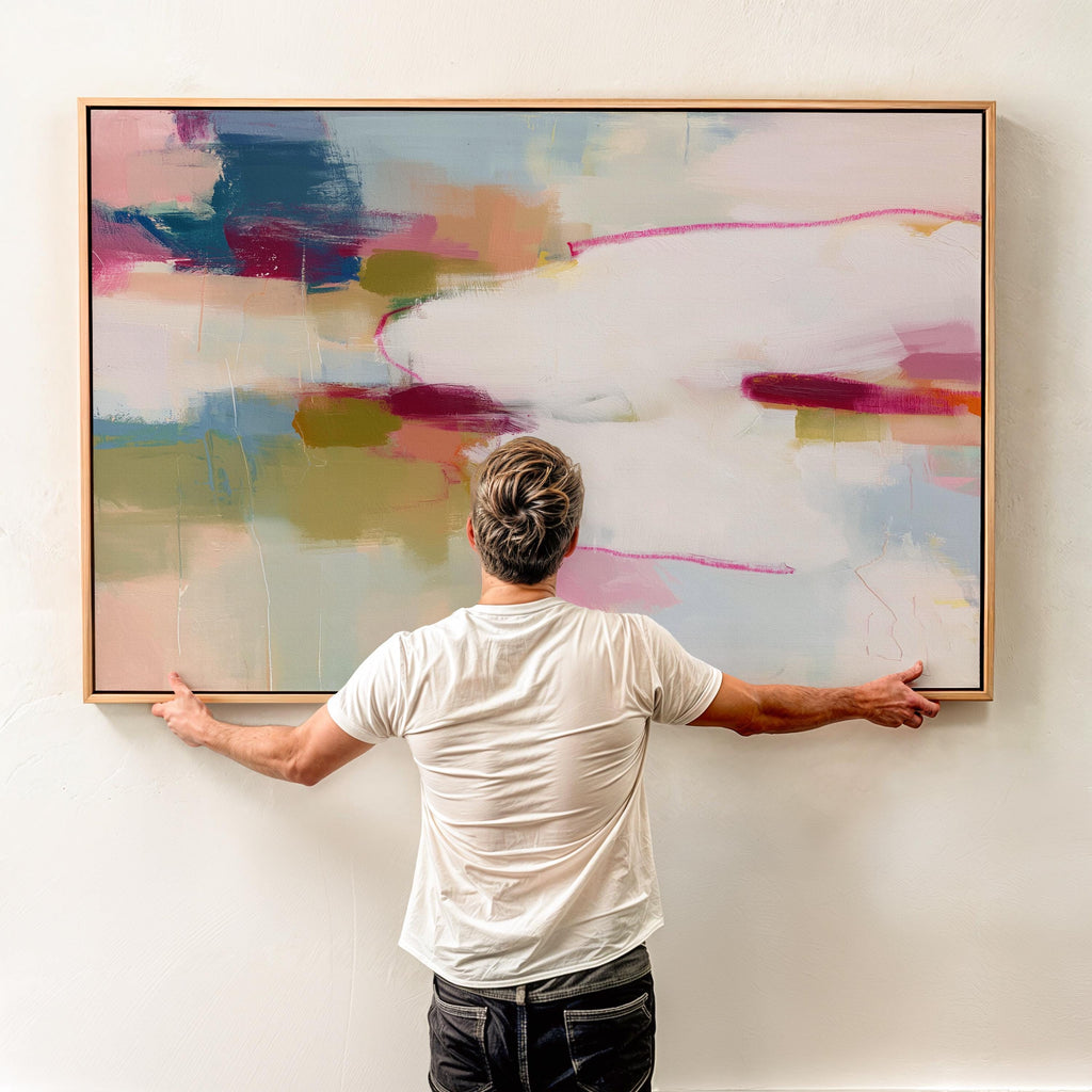Horizontal abstract canvas wall art in pink, ivory, moss green, and coral tones. Gentle color blending and layered texture create a calm, balanced aesthetic ideal for soft contemporary interiors. Perfect above a sofa, bed, or in an office, this artwork adds warmth and refined style. Gallery-wrapped canvas wall art with a fine-textured surface, ready to hang for a clean, polished finish.