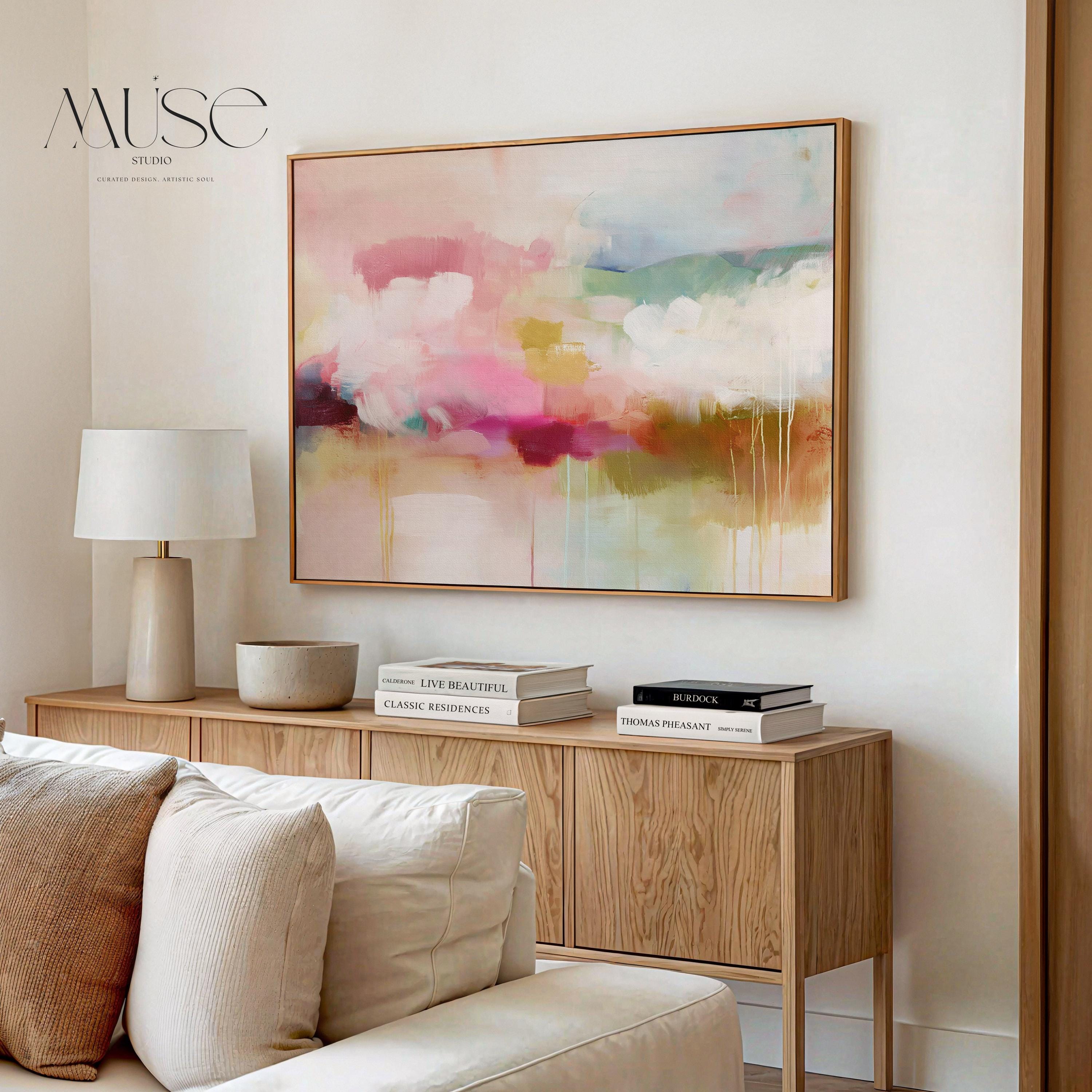 Horizontal framed abstract wall art blending blush pink, sage green, and golden umber with soft painterly drips. A warm minimalist design that evokes natural horizons and organic calm, ideal for living rooms, dining spaces, or design studios. Floater framed in FSC-certified wood with archival cotton-blend canvas for a gallery-quality presentation.