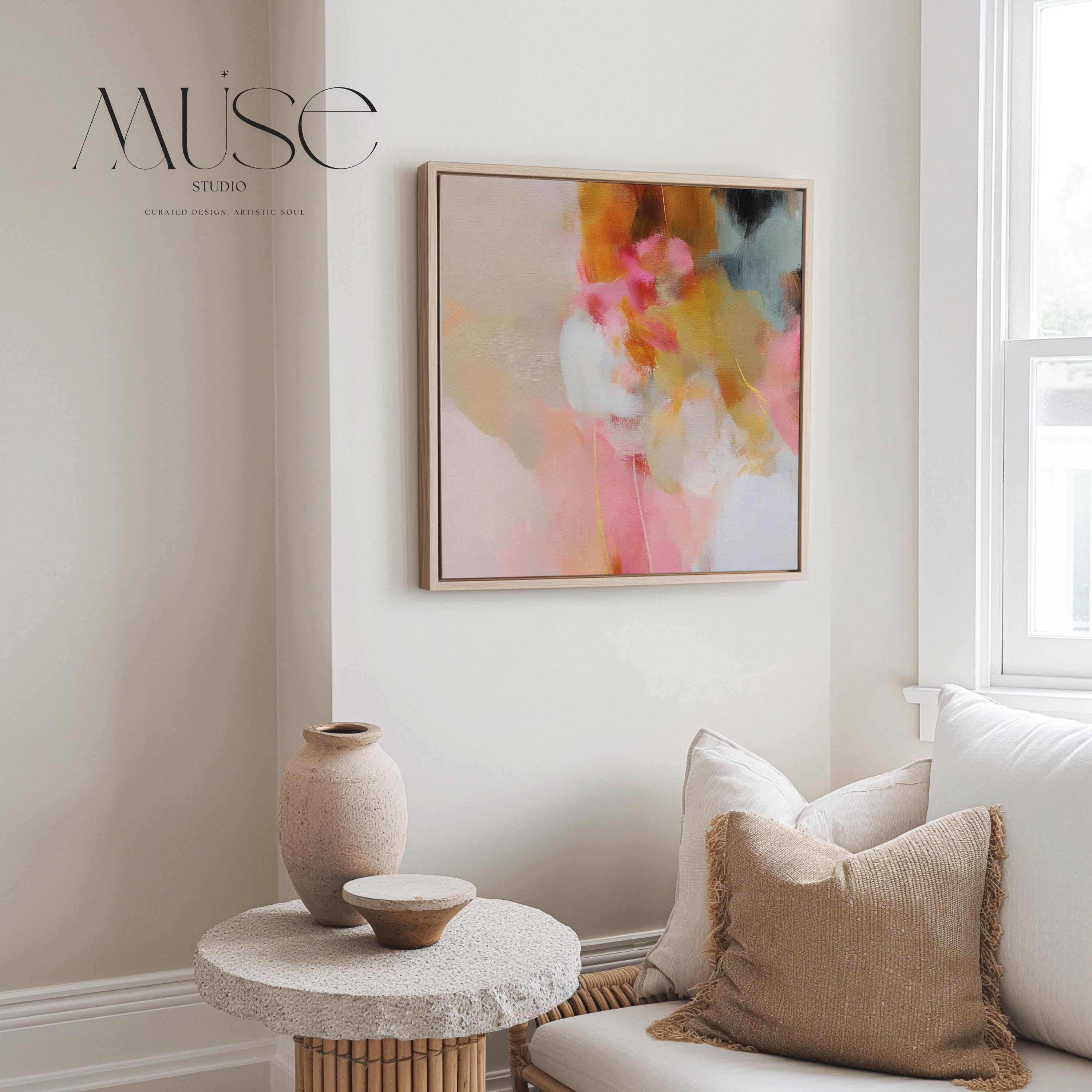 Square framed abstract wall art featuring blush pink, golden ochre, and pale blue hues in a softly layered composition. Perfect for Soft Contemporary interiors, this refined artwork complements bedrooms, living rooms, or curated studios with its warm minimalist palette and painterly texture. Floater framed in FSC-certified wood and printed on archival cotton-blend canvas for a designer-quality finish.