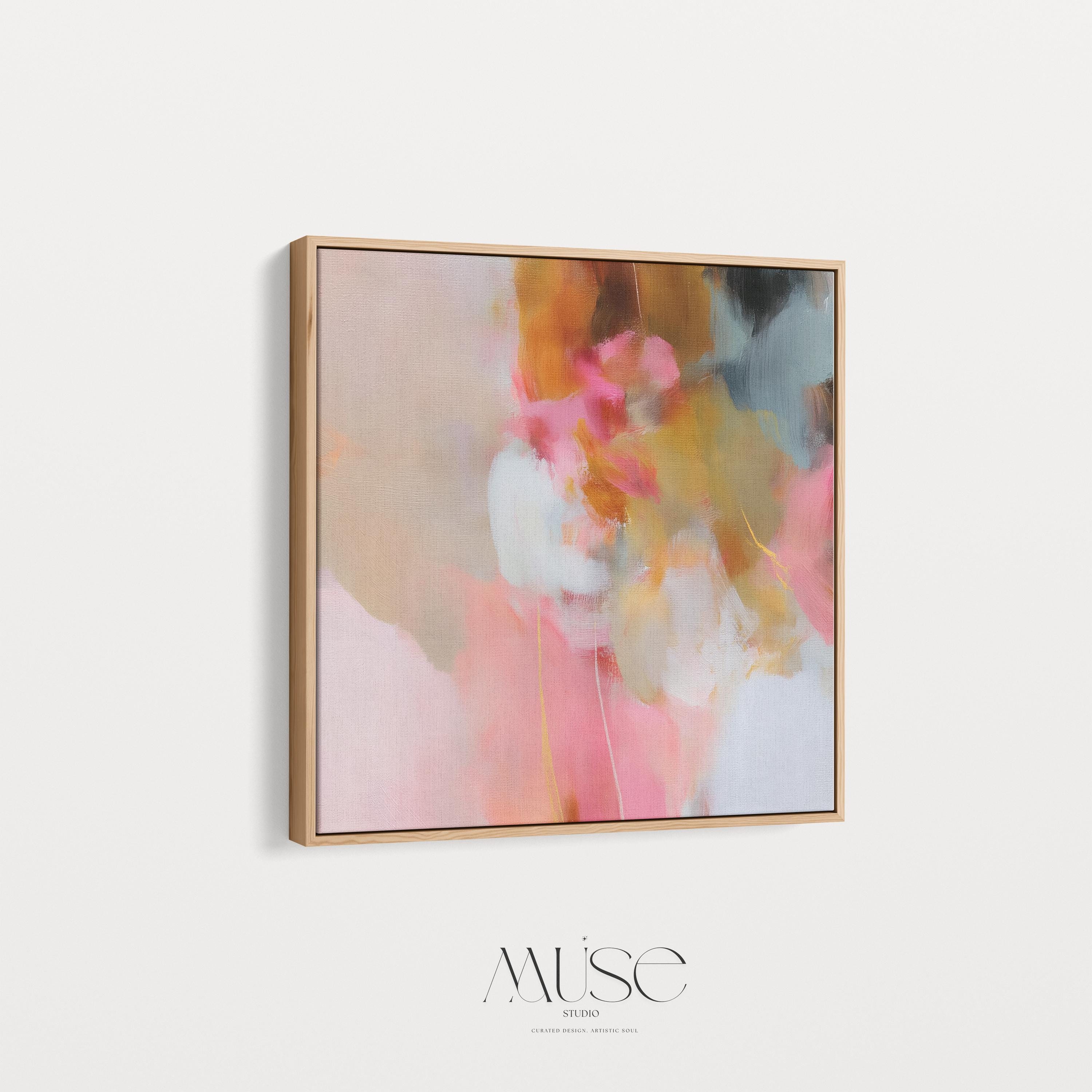 Square framed abstract wall art featuring blush pink, golden ochre, and pale blue hues in a softly layered composition. Perfect for Soft Contemporary interiors, this refined artwork complements bedrooms, living rooms, or curated studios with its warm minimalist palette and painterly texture. Floater framed in FSC-certified wood and printed on archival cotton-blend canvas for a designer-quality finish.