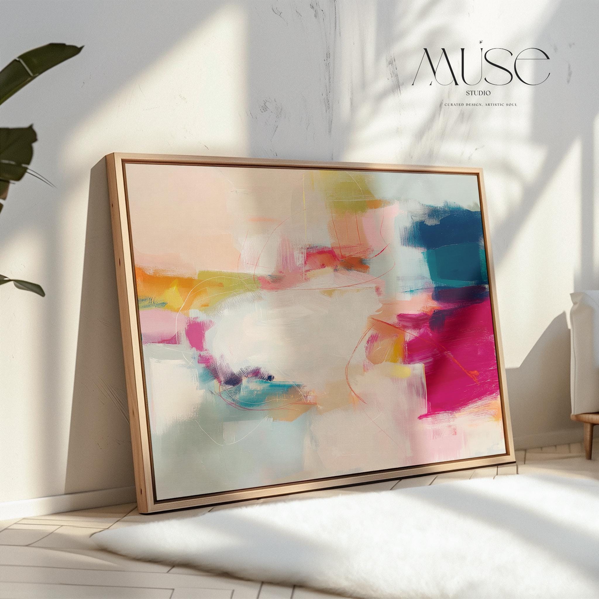 Horizontal framed abstract wall art featuring pink, blue, and golden hues in a softly blended composition. Ideal for Soft Contemporary interiors, this elegant piece brings warmth and sophistication to living rooms, offices, or designer-curated spaces. Floater framed in FSC-certified wood and printed on archival cotton-blend canvas for a premium gallery-quality finish.