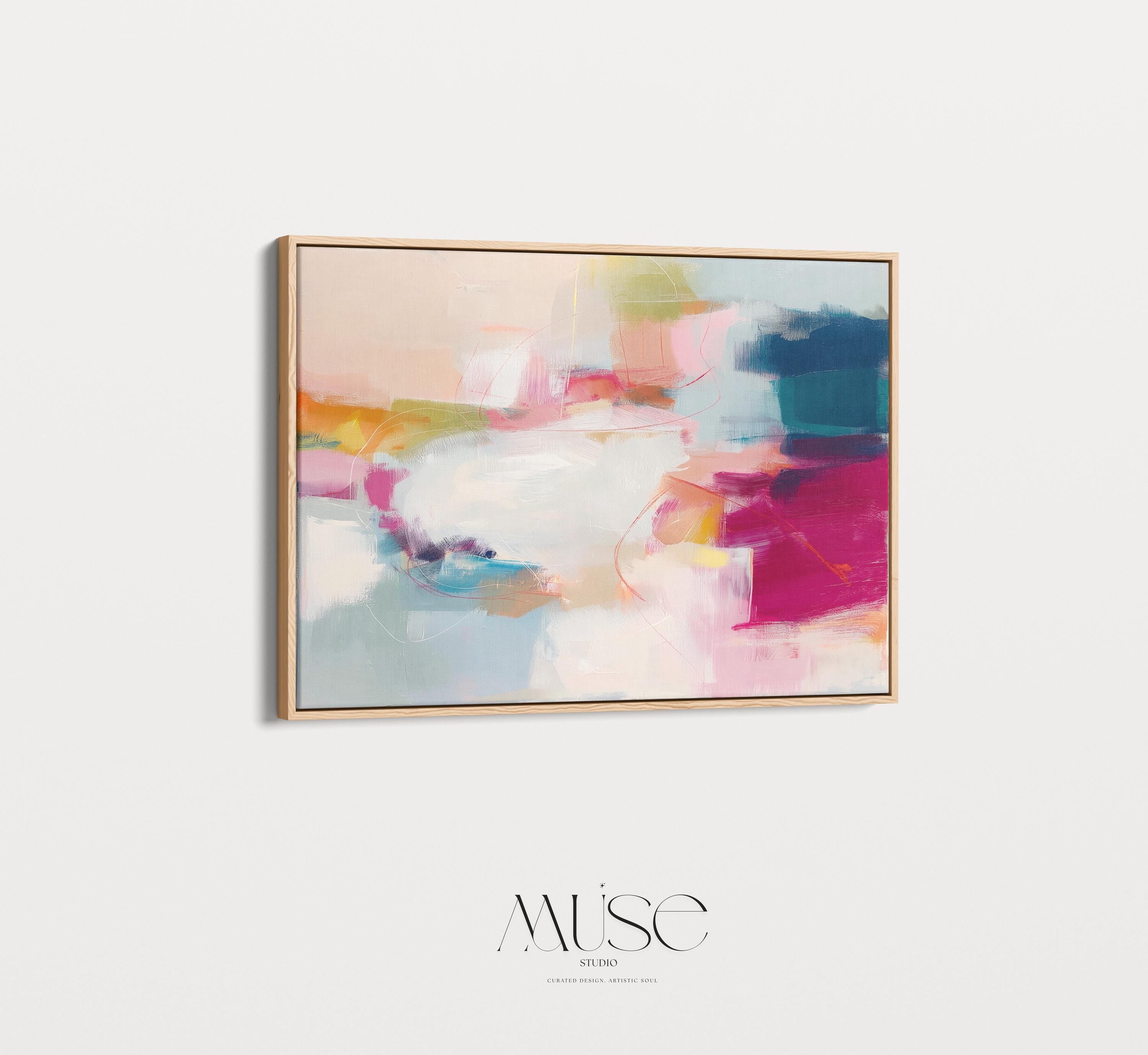 Horizontal framed abstract wall art featuring pink, blue, and golden hues in a softly blended composition. Ideal for Soft Contemporary interiors, this elegant piece brings warmth and sophistication to living rooms, offices, or designer-curated spaces. Floater framed in FSC-certified wood and printed on archival cotton-blend canvas for a premium gallery-quality finish.