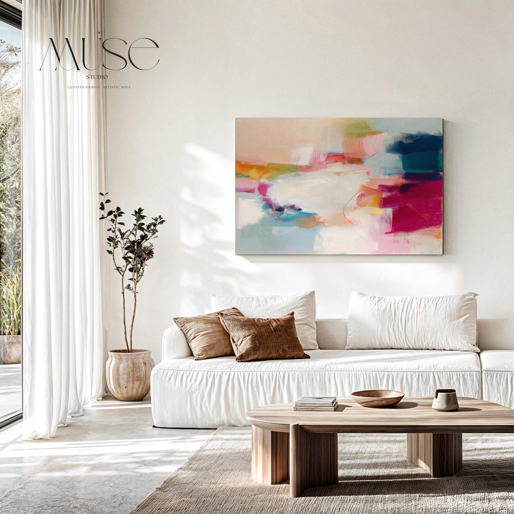 Horizontal abstract canvas artwork in shades of blush pink, soft gold, and muted blue with painterly layers and gentle movement. Ideal for Soft Contemporary interiors, this design brings calm vibrancy to living rooms, offices, or curated spaces. Printed on archival cotton-blend canvas and hand-stretched for a gallery-quality finish with modern appeal.