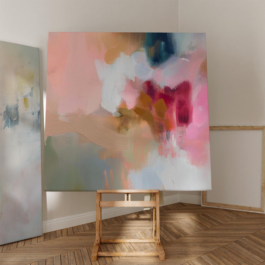 Large square canvas wall art featuring a blend of blush pink, coral, taupe, and teal abstract brushstrokes. The soft composition and painterly texture create a calm, refined look perfect for Soft Contemporary or Warm Neutral interiors. Available as an unframed or framed cotton canvas print.