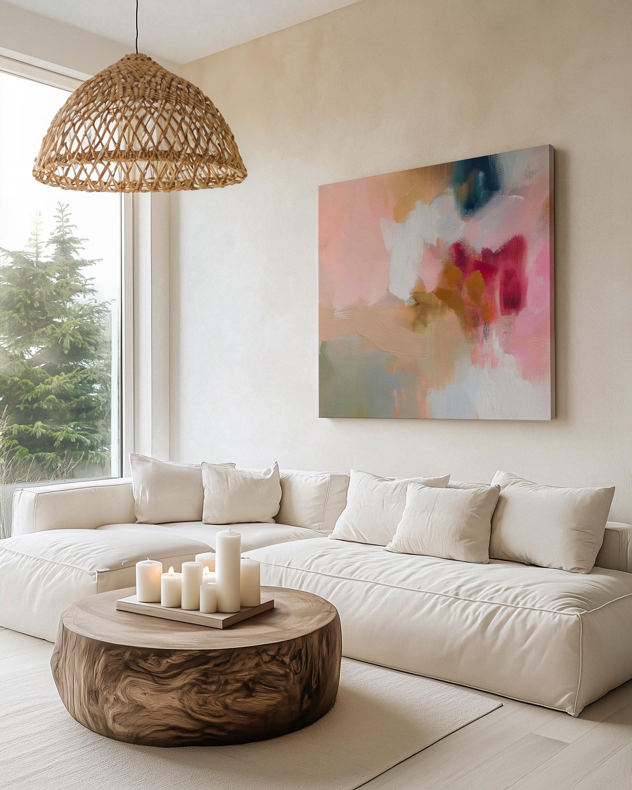 Large square canvas wall art featuring a blend of blush pink, coral, taupe, and teal abstract brushstrokes. The soft composition and painterly texture create a calm, refined look perfect for Soft Contemporary or Warm Neutral interiors. Available as an unframed or framed cotton canvas print.