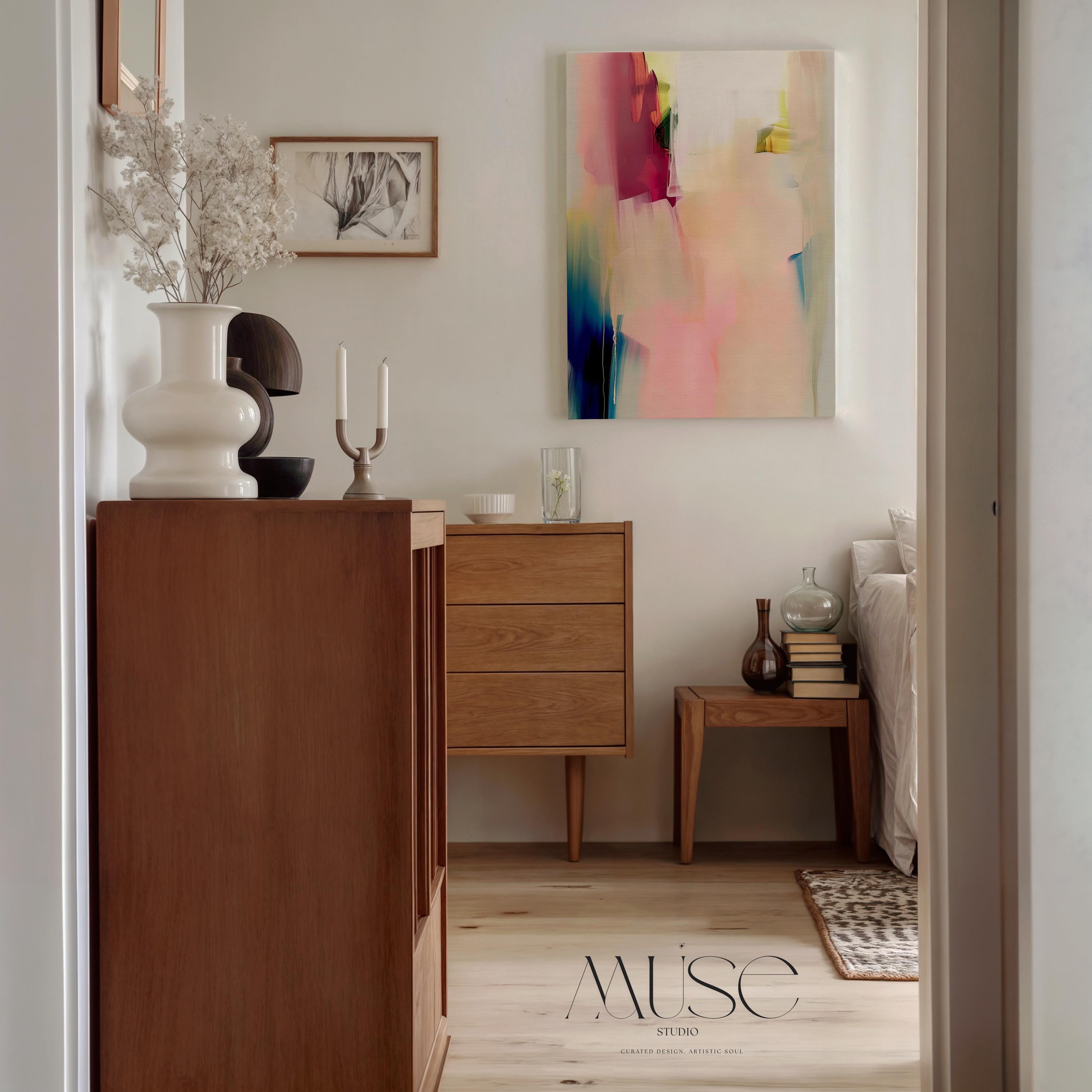 Soft abstract canvas wall art featuring blush pink, teal, and warm beige tones with gentle brushstrokes. The composition evokes a serene modern feel—ideal for minimalist or contemporary bedrooms. Available as gallery-wrapped canvas or framed wall art for curated designer decor.