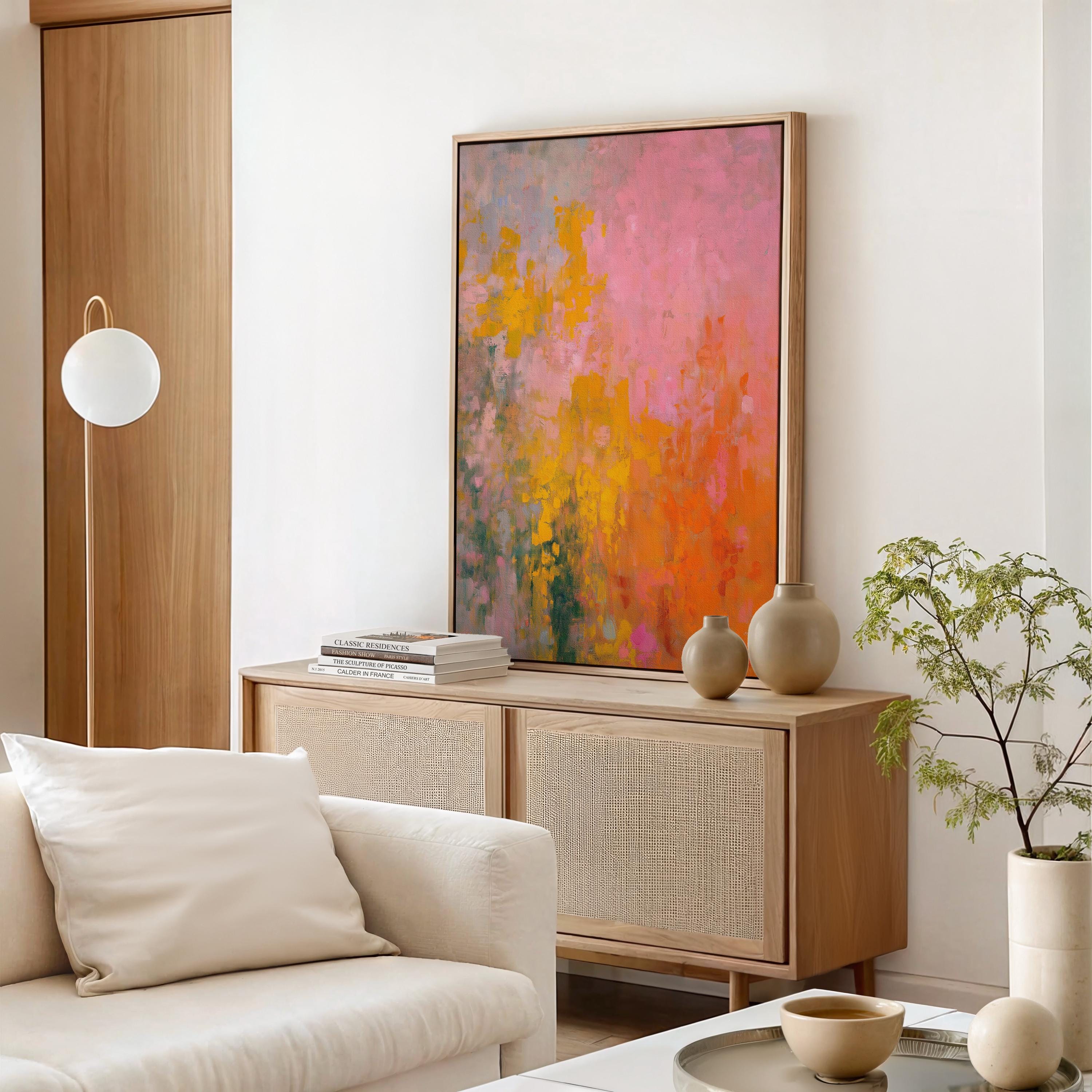 Large colorful abstract canvas wall art in pink, orange, and yellow tones with painterly brushwork. A bold, energetic statement piece for modern or transitional living room decor. Available as gallery-wrapped or framed canvas for premium interior design styling.