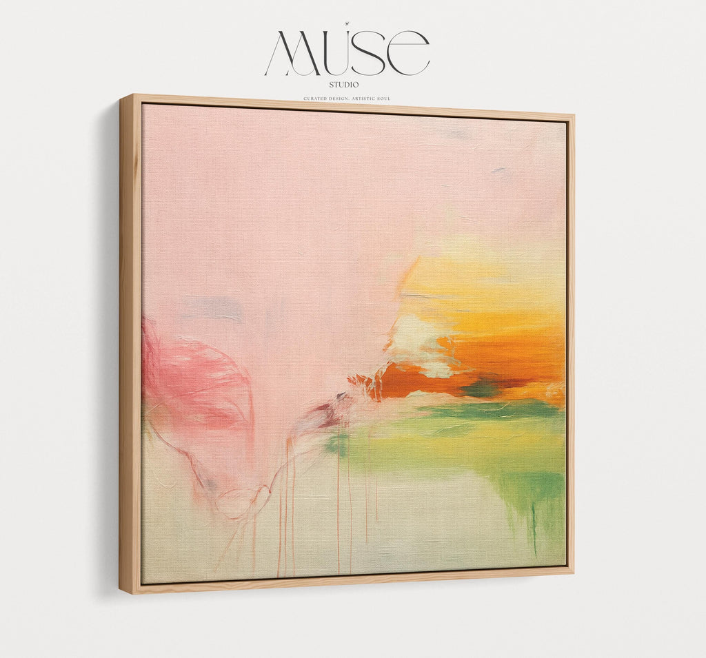 Square abstract wall art in blush pink, soft peach, golden ochre, and fresh green tones, featuring gentle painterly blends and subtle drips. Styled in a natural wood floater frame, the piece reflects soft contemporary and warm minimal design, ideal for bedrooms, living rooms, or calming modern interiors. Gallery-wrapped framed canvas by Muse Studio.