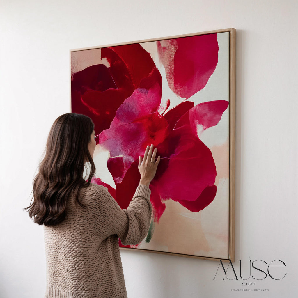 poinsettia-inspired abstract wall art in deep red, berry, and blush tones on framed canvas. Bold holiday color pop style with soft painterly texture. Ideal for Christmas entryway, dining room, or winter living room decor. Premium framed canvas artwork by Muse Studio.