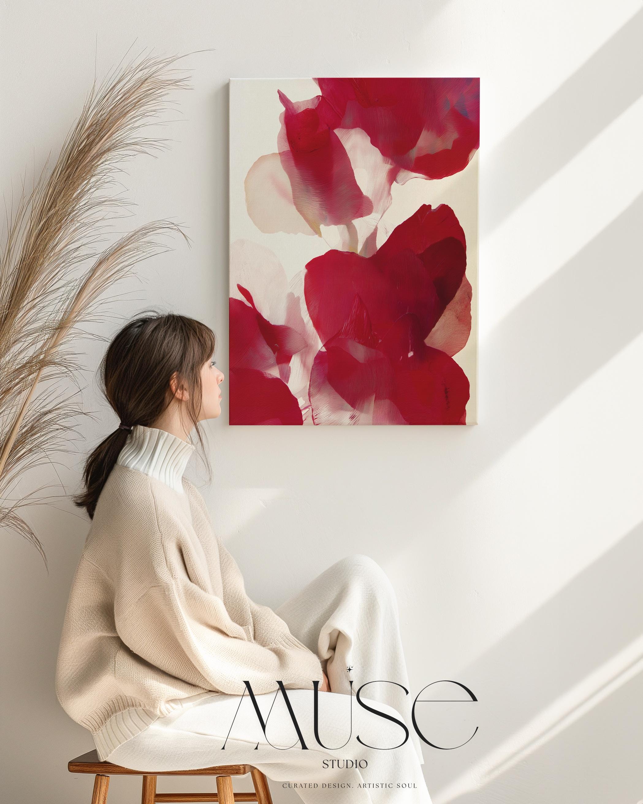 Vertical abstract canvas featuring layered crimson, berry red, and blush floral forms with soft painterly textures. Modern holiday wall art in a warm minimalist, color-pop style—ideal for Christmas entryways, seasonal dining rooms, or cozy winter homes. Gallery-wrapped canvas by Muse Studio