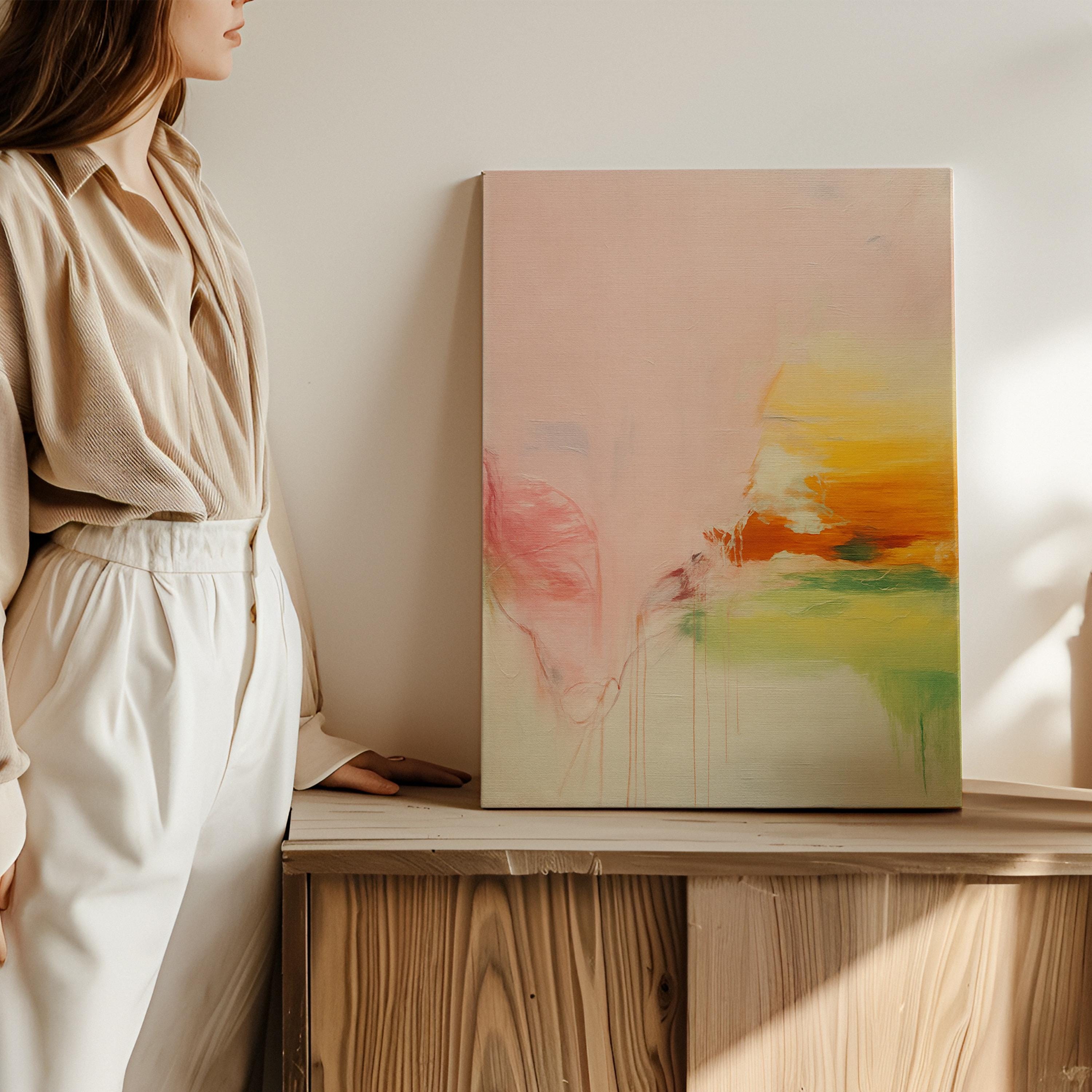 Vertical abstract canvas wall art in blush, peach, and golden pastel tones with soft modern preppy styling. Gentle blends and airy color transitions make it ideal for feminine bedrooms, pastel-inspired interiors, and bright modern spaces. Available as gallery-wrapped or floater framed canvas by Muse Studio.