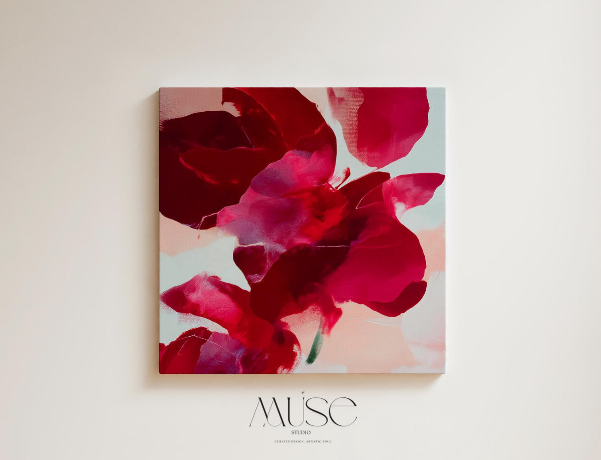 Square abstract holiday canvas featuring deep crimson, berry, and blush painterly petals with soft blended edges. Color-pop seasonal wall art in a warm minimalist style, ideal for Christmas living rooms, winter bedrooms, or festive entryways. Premium gallery-wrapped canvas by Muse Studio.
