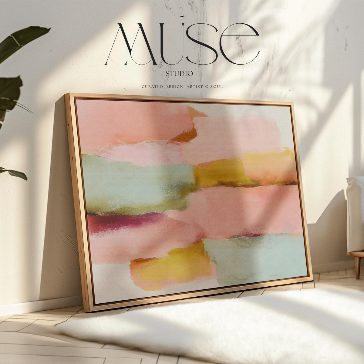 Large horizontal abstract framed canvas wall art featuring blush pink, coral, muted aqua blue, golden ochre, and plum layered brushstrokes, styled above a neutral sofa in a modern living room, offering warm contemporary color and balanced movement for oversized wall placement.
