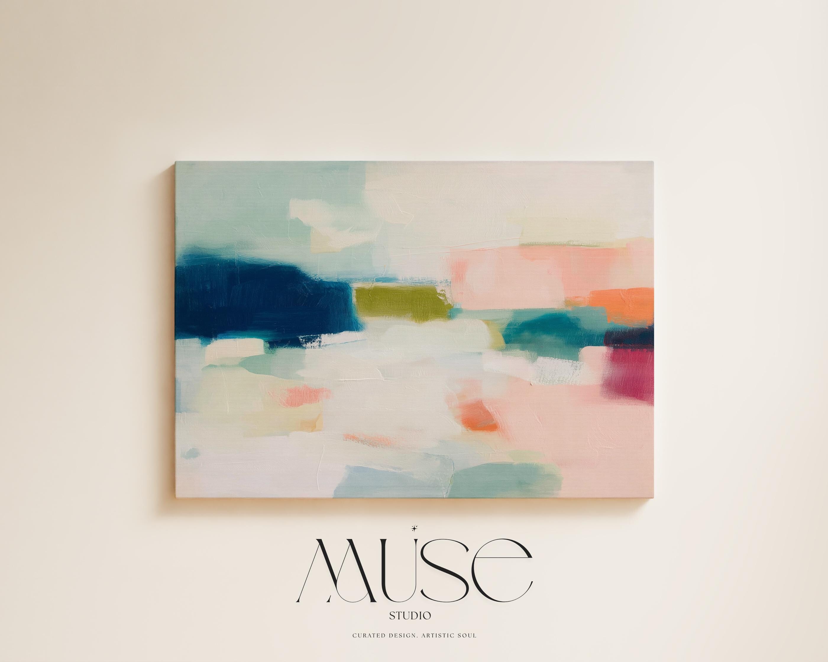 Large horizontal abstract canvas wall art featuring navy blue, muted aqua, blush pink, olive green, and coral tones layered across a soft white background, designed for above couch placement in a modern coastal living room, offering rich contrast and contemporary warmth.