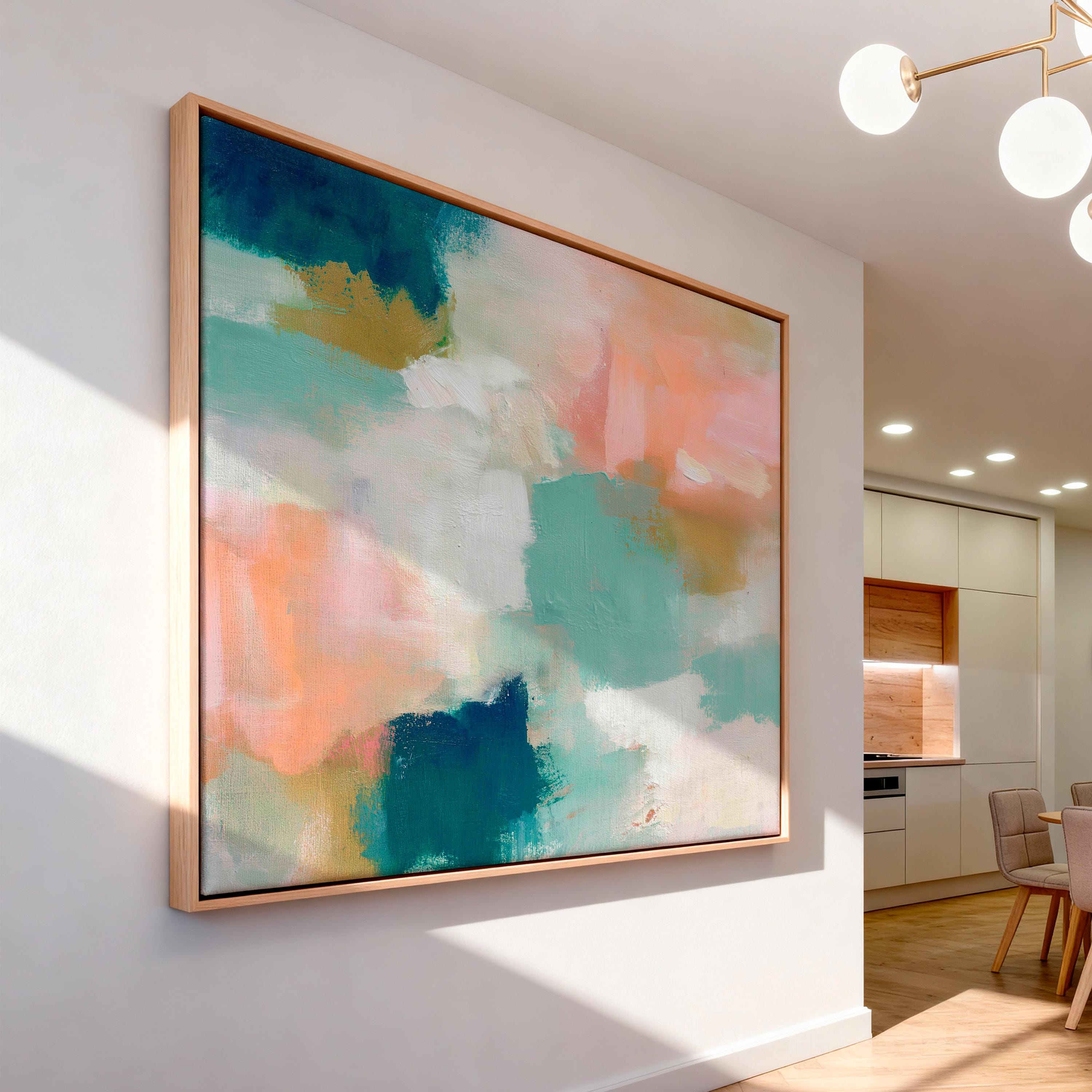Drifted Light No. 1016 by Muse Studio & Co. bright coastal abstract framed canvas wall art in aqua blue and blush pink tones, printed with museum-grade giclée inks on premium gallery-wrapped artist canvas and framed in a natural wood float frame, styled as colorful coastal wall decor in a light-filled designer living room with custom frame options in natural, white, black, antique gold, and antique silver.