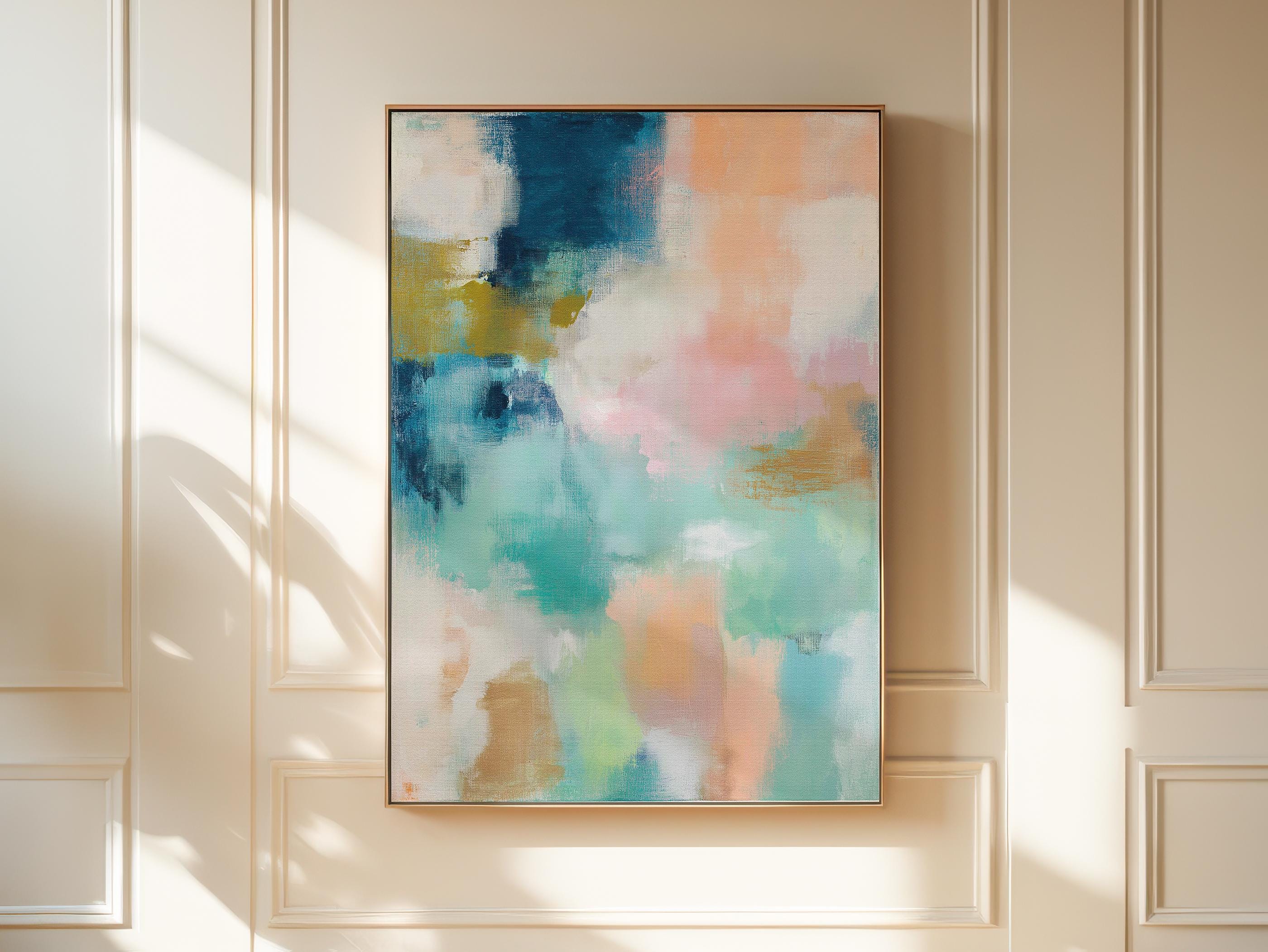Large vertical abstract framed canvas wall art featuring layered teal, soft peach, cream, blush, and muted gold tones, styled for a serene bedroom or above a console table, offering coastal warmth and quiet luxury in a tall modern interior.