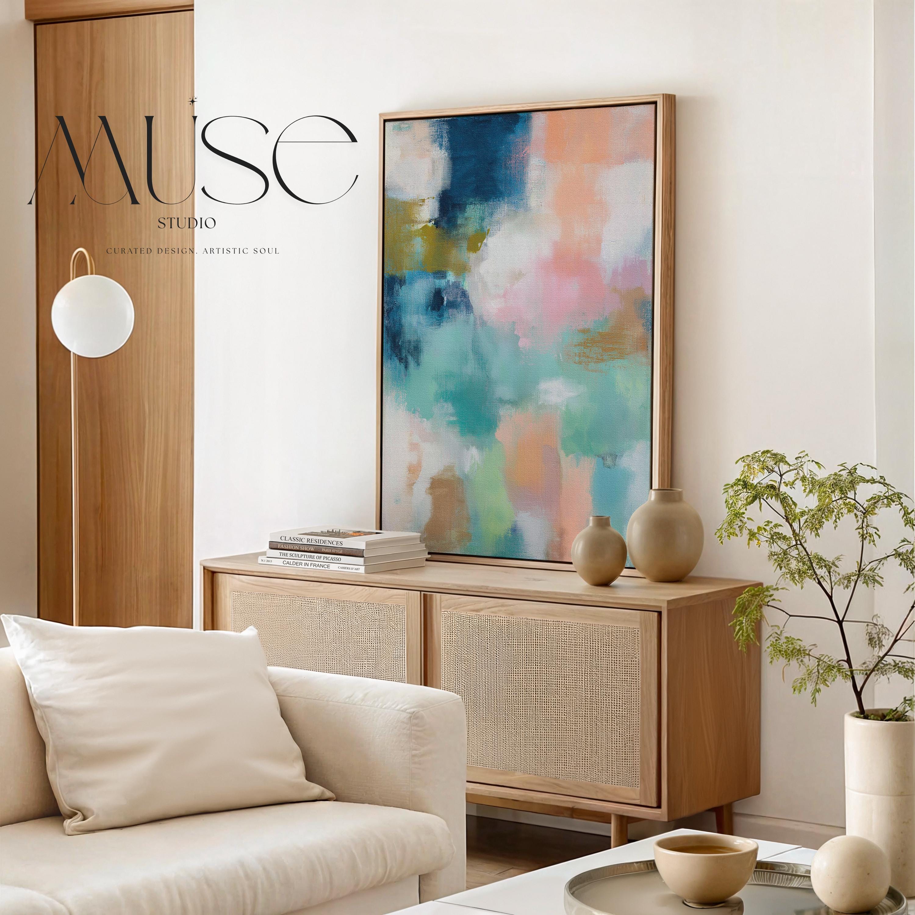 Large vertical abstract framed canvas wall art featuring layered teal, soft peach, cream, blush, and muted gold tones, styled for a serene bedroom or above a console table, offering coastal warmth and quiet luxury in a tall modern interior.