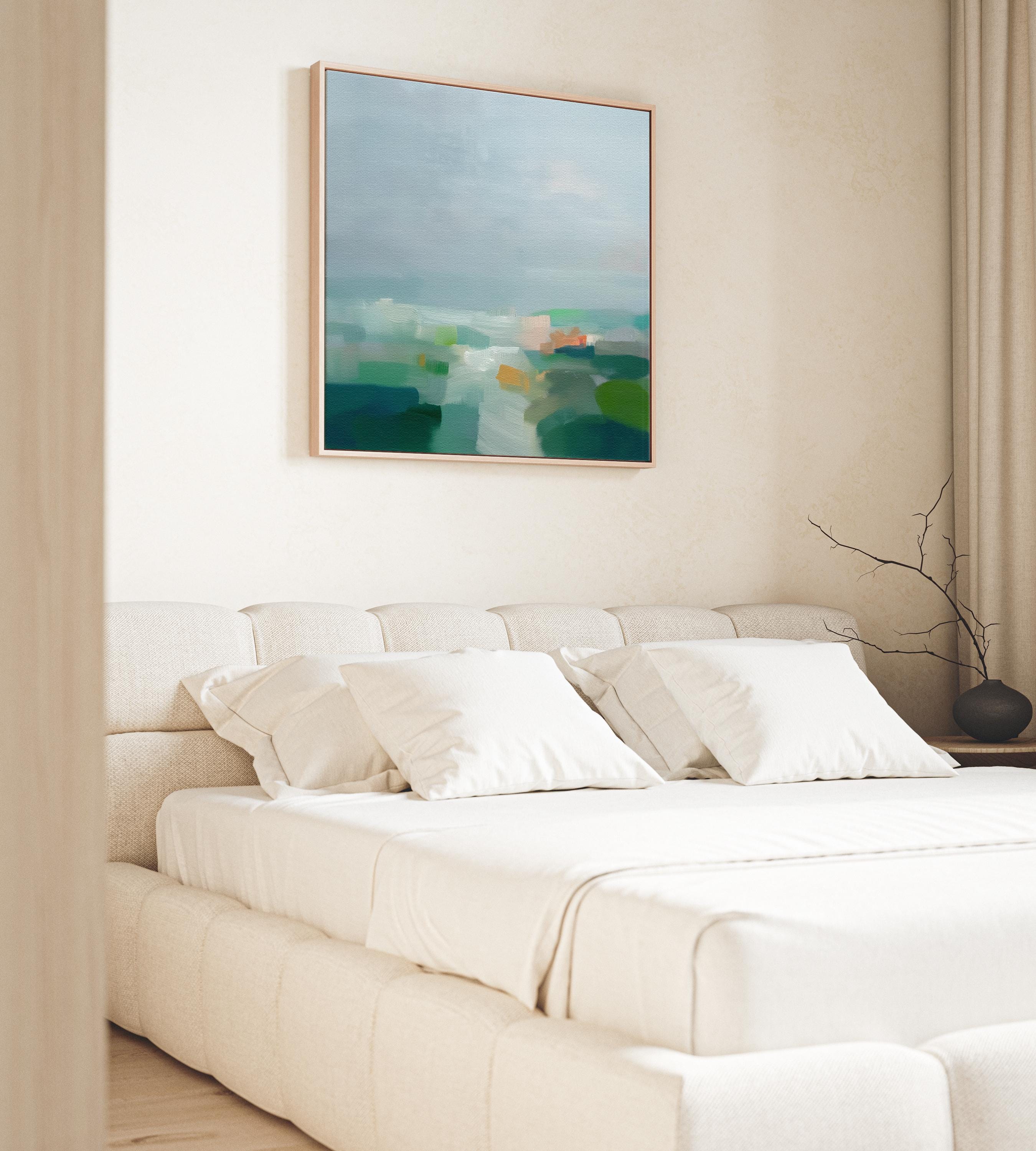 Large square abstract decor wall art featuring mist blue, sea glass green, and soft teal tones, framed in natural wood and styled in a calm contemporary living room, creating a serene coastal-inspired focal point for spacious interiors.
