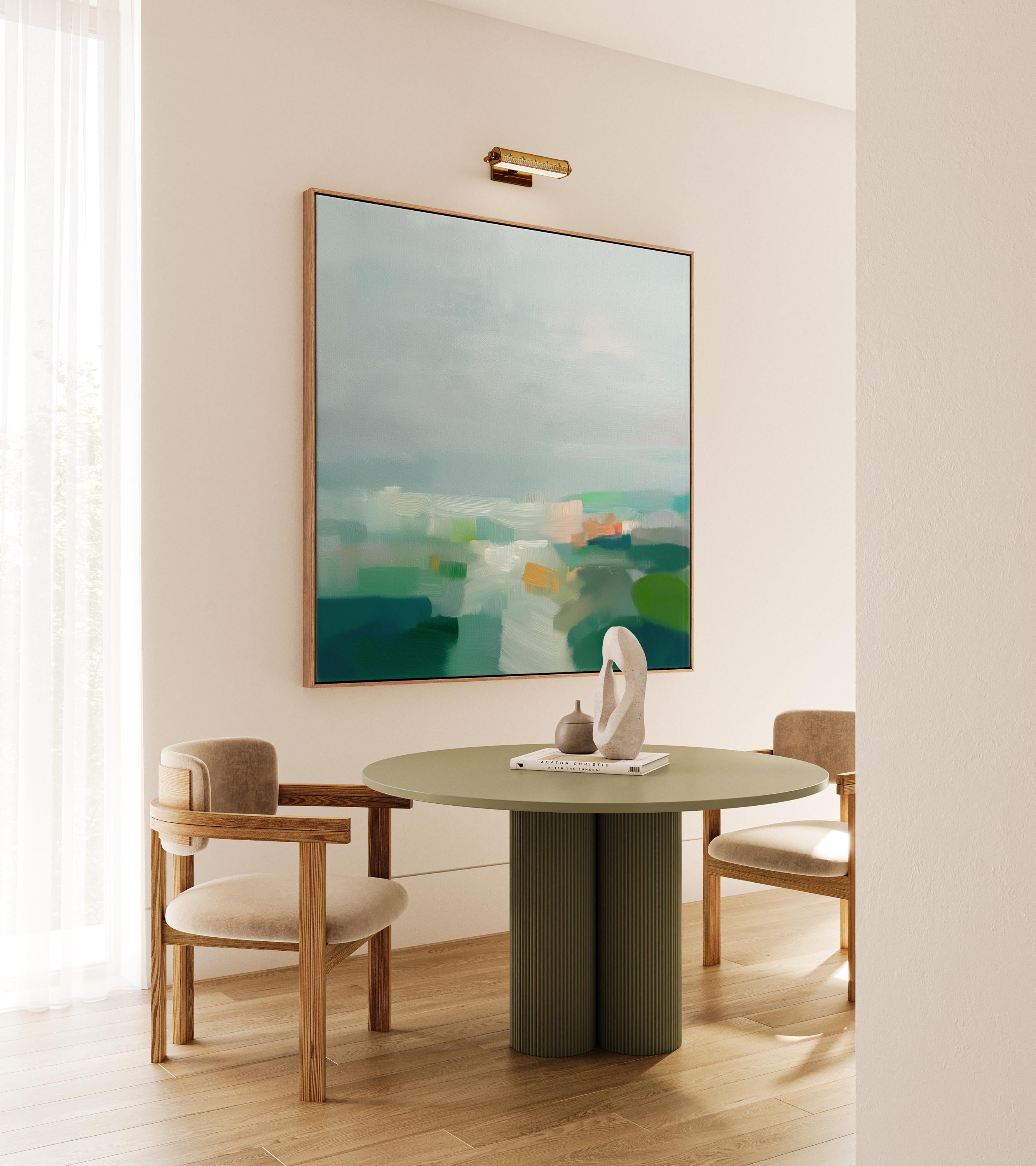 Large square abstract decor wall art featuring mist blue, sea glass green, and soft teal tones, framed in natural wood and styled in a calm contemporary living room, creating a serene coastal-inspired focal point for spacious interiors.