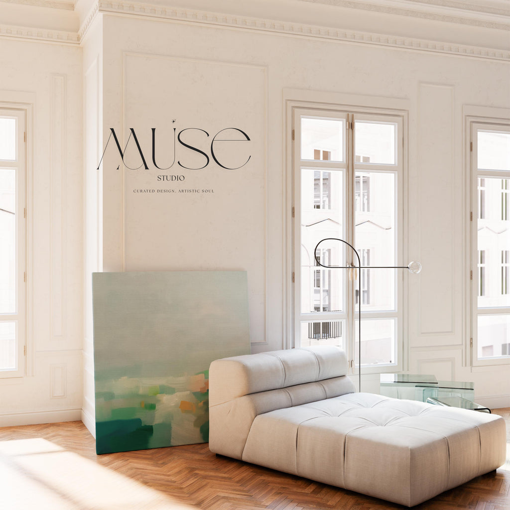 Large square stretched canvas wall art in layered sage, forest green, and soft blue tones styled in a light farmhouse interior, adding calm countryside color and gentle horizon depth to neutral walls.