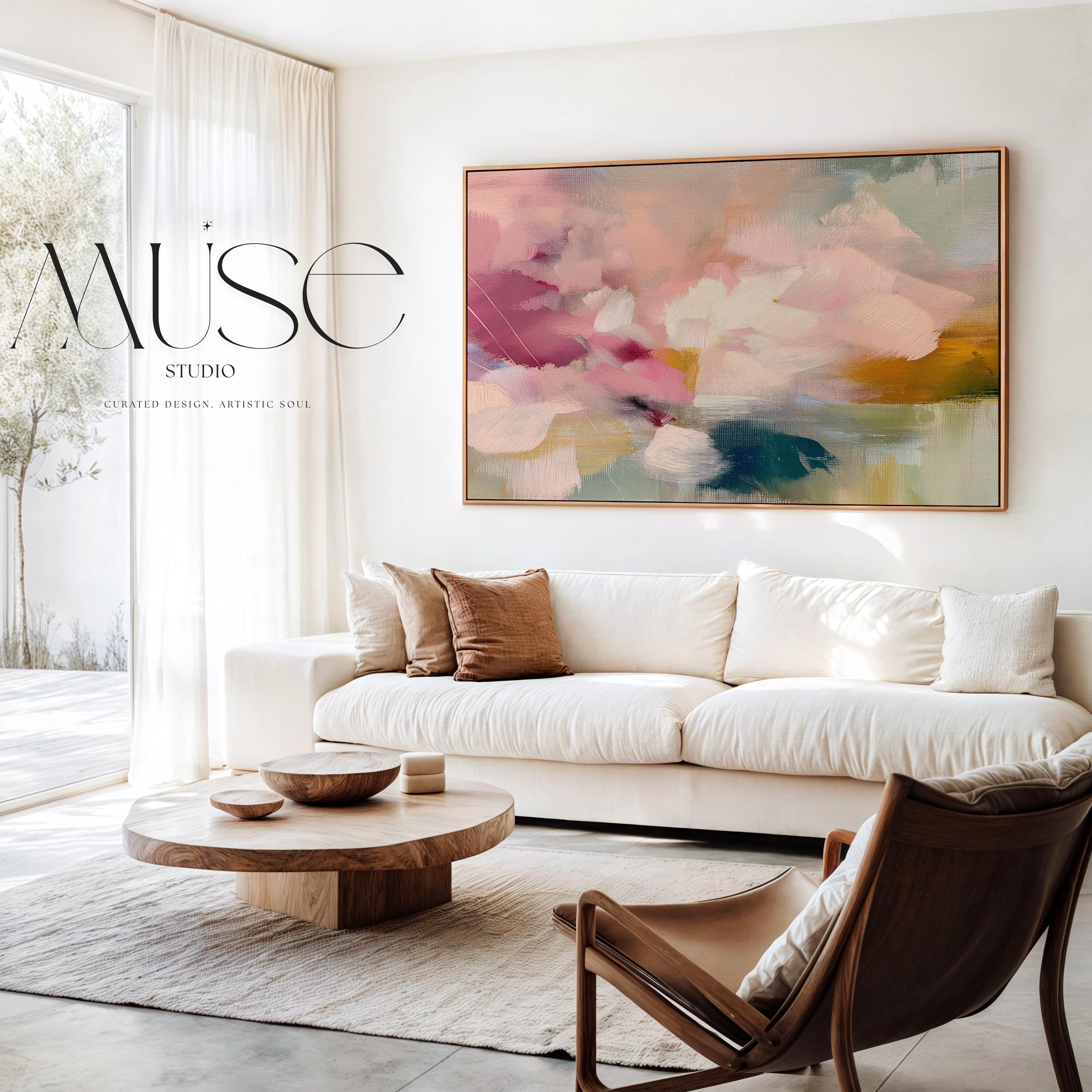 Soft blush, coral, teal and cream floral abstract framed canvas wall art by Muse Studio & Co. in a natural wood floating frame, styled as a calming focal piece in a warm contemporary living space.
