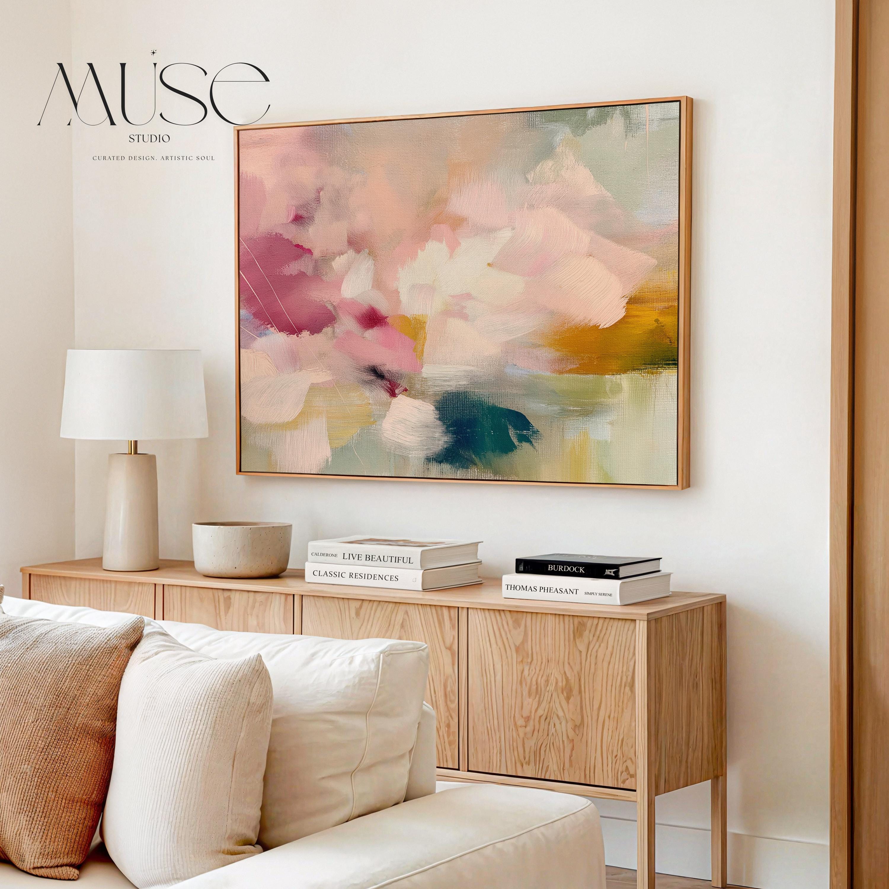 Soft blush, coral, teal and cream floral abstract framed canvas wall art by Muse Studio & Co. in a natural wood floating frame, styled as a calming focal piece in a warm contemporary living space.