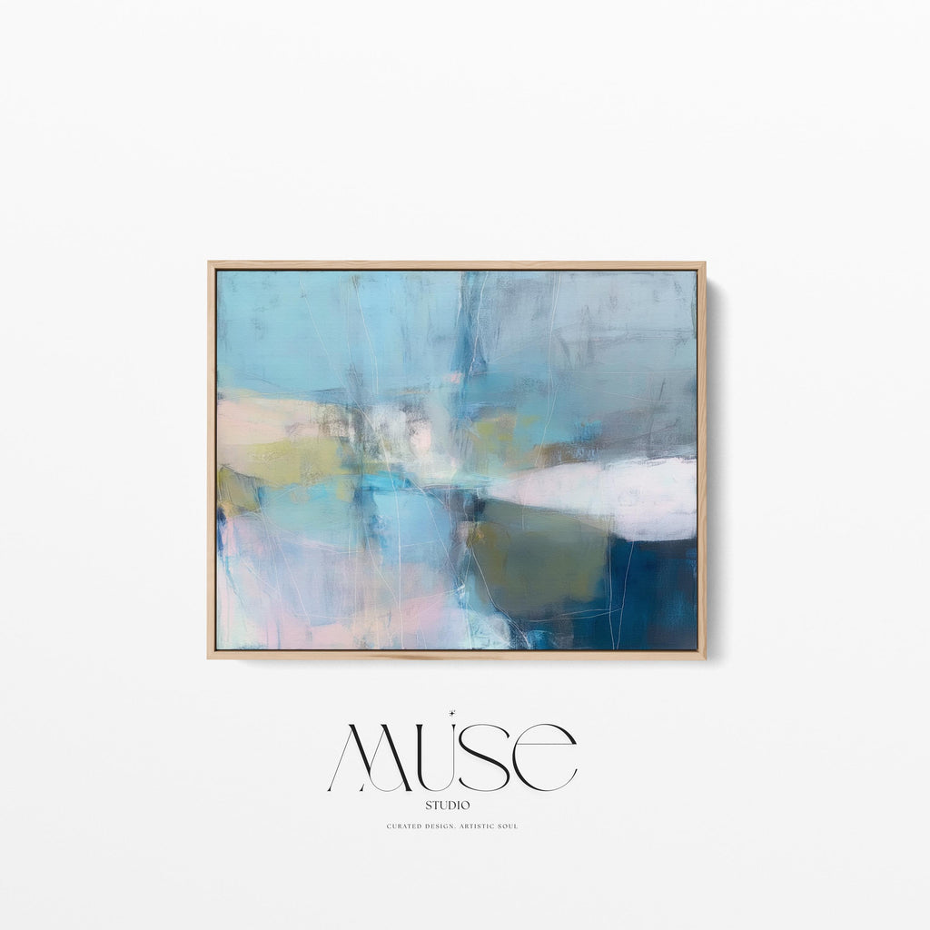 Muse Studio framed horizontal coastal neutral abstract wall art in sea glass blue, blush, muted olive, and gray tones, printed with museum-grade giclée inks on premium gallery-wrapped canvas in a natural wood floating frame for beach house interiors.
