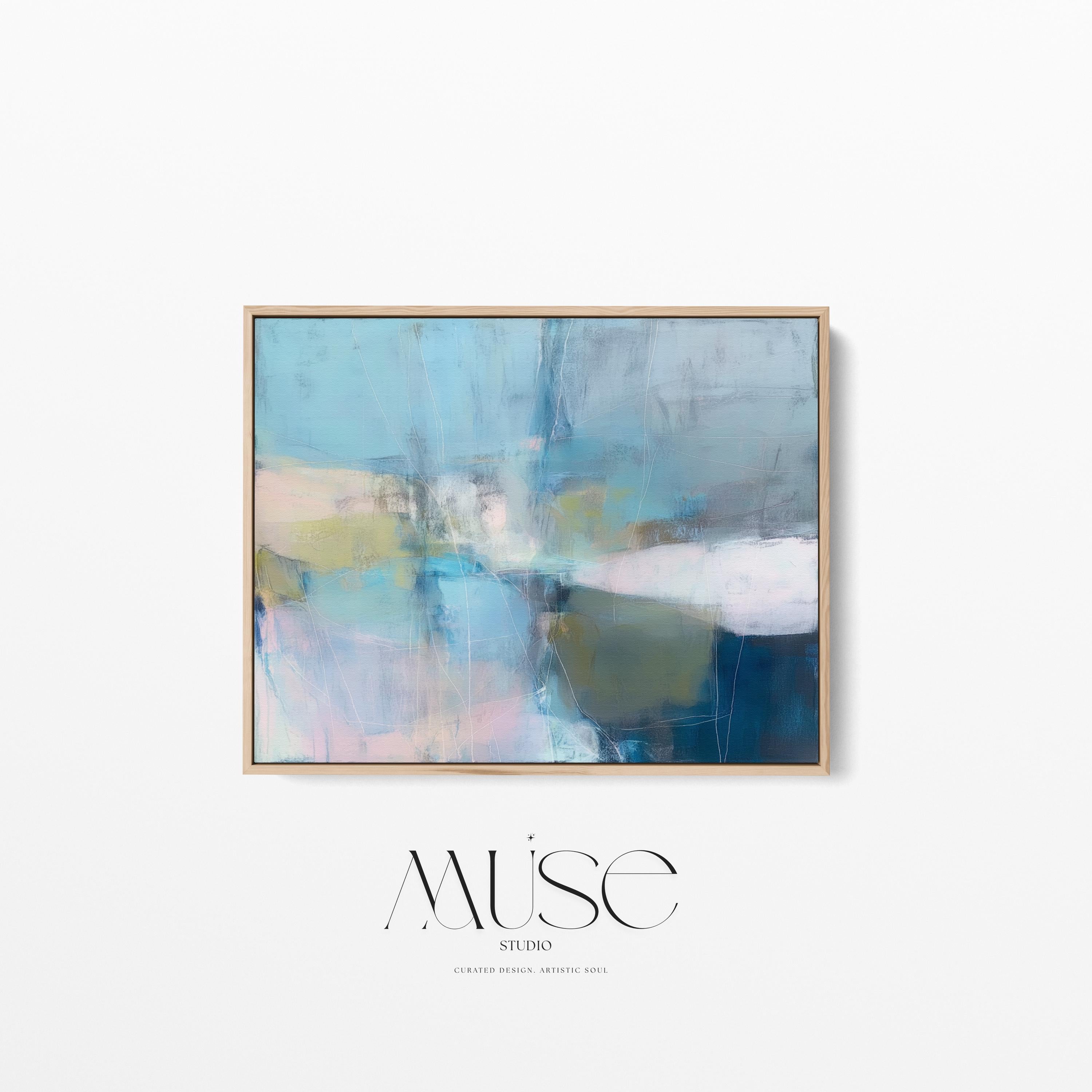 Muse Studio framed horizontal coastal neutral abstract wall art in sea glass blue, blush, muted olive, and gray tones, printed with museum-grade giclée inks on premium gallery-wrapped canvas in a natural wood floating frame for beach house interiors.