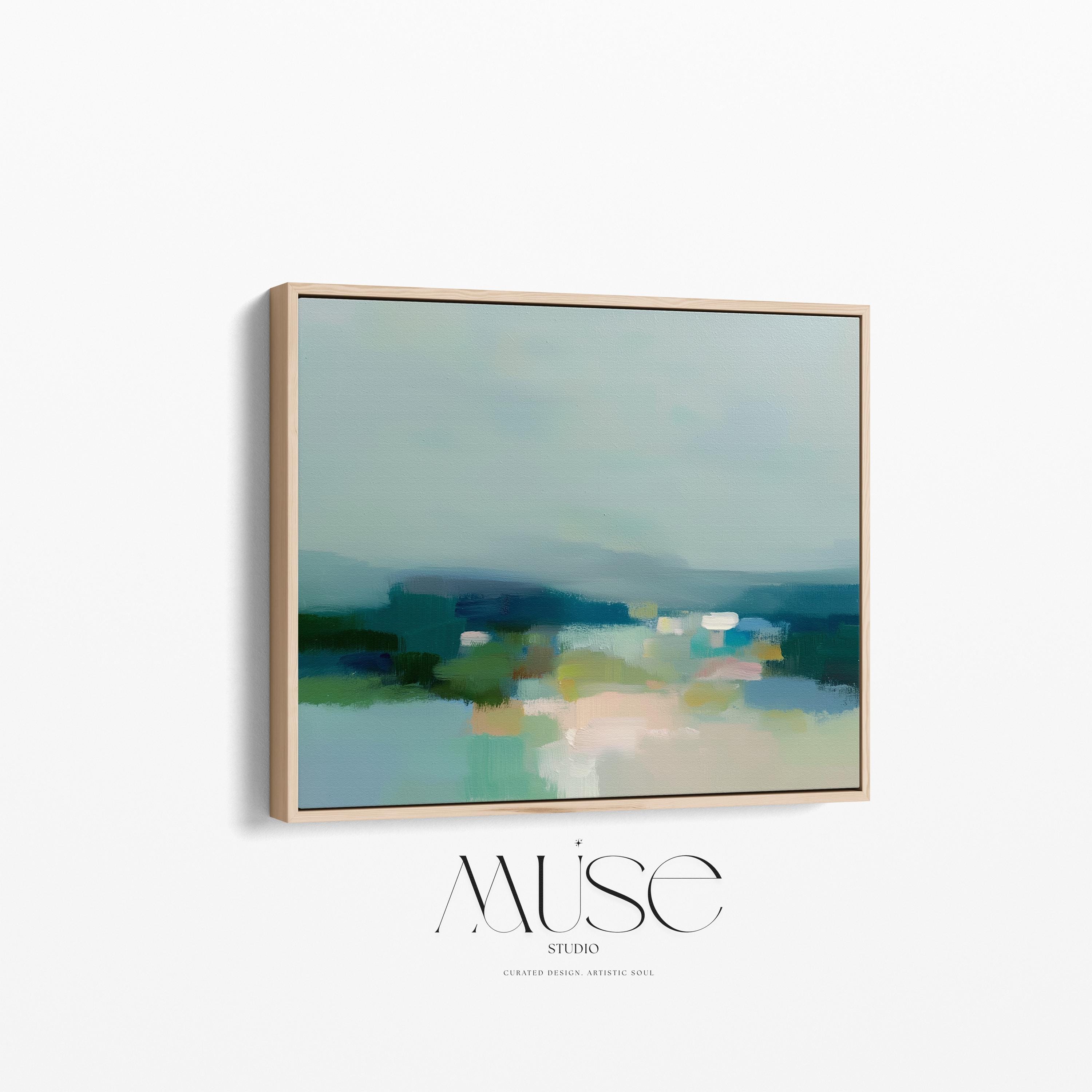Muse Studio large framed canvas wall art in a coastal neutral abstract composition featuring soft teal, sage, and sand tones with layered horizon movement, printed with museum-grade giclée inks on premium artist canvas and framed in natural wood for living room styling.
