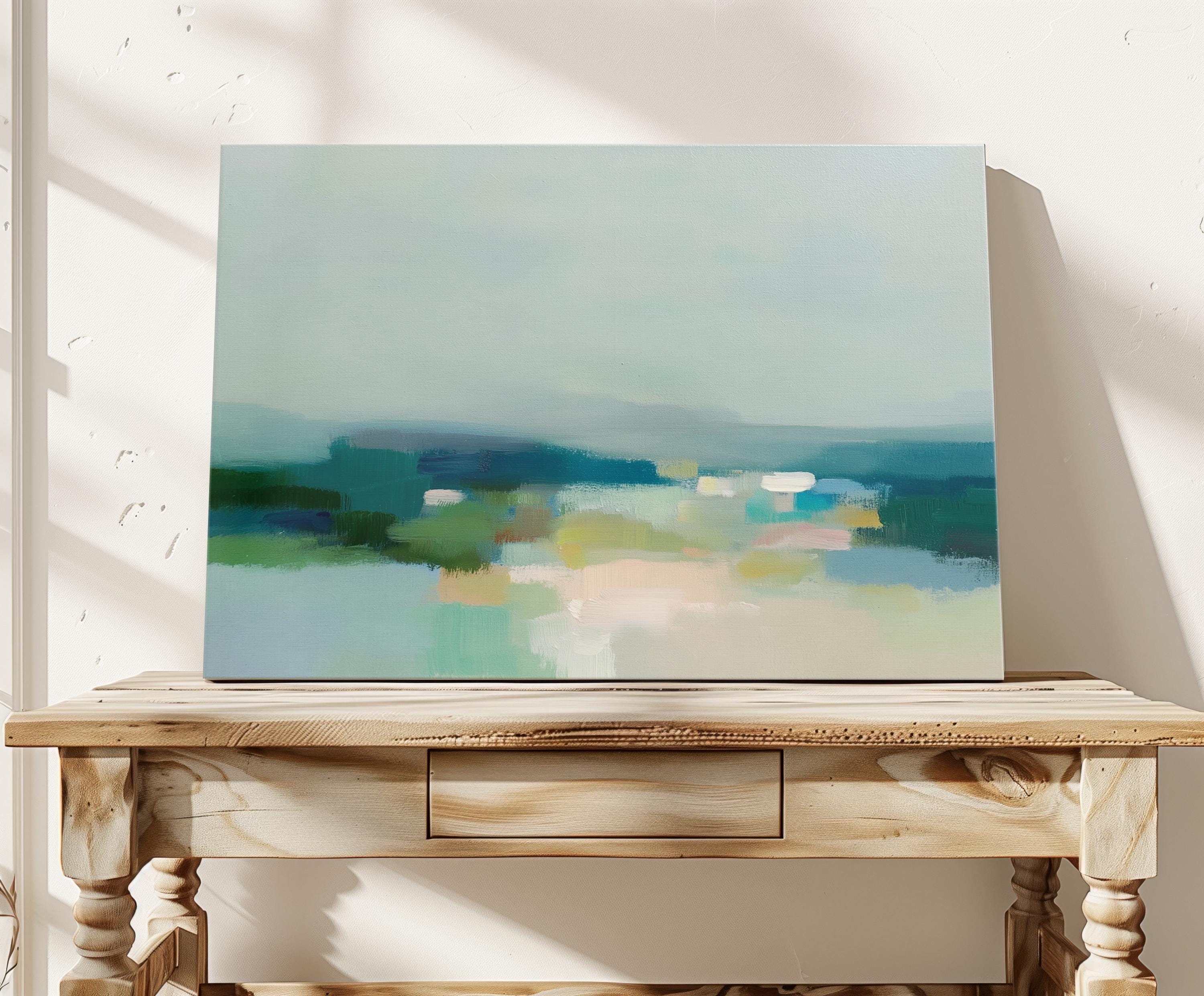 Muse Studio large gallery-wrapped canvas wall art featuring a coastal neutral abstract composition in soft teal, sage, sand, and deep blue tones, printed with museum-grade giclée inks on premium artist canvas for refined bedroom and living room interiors.