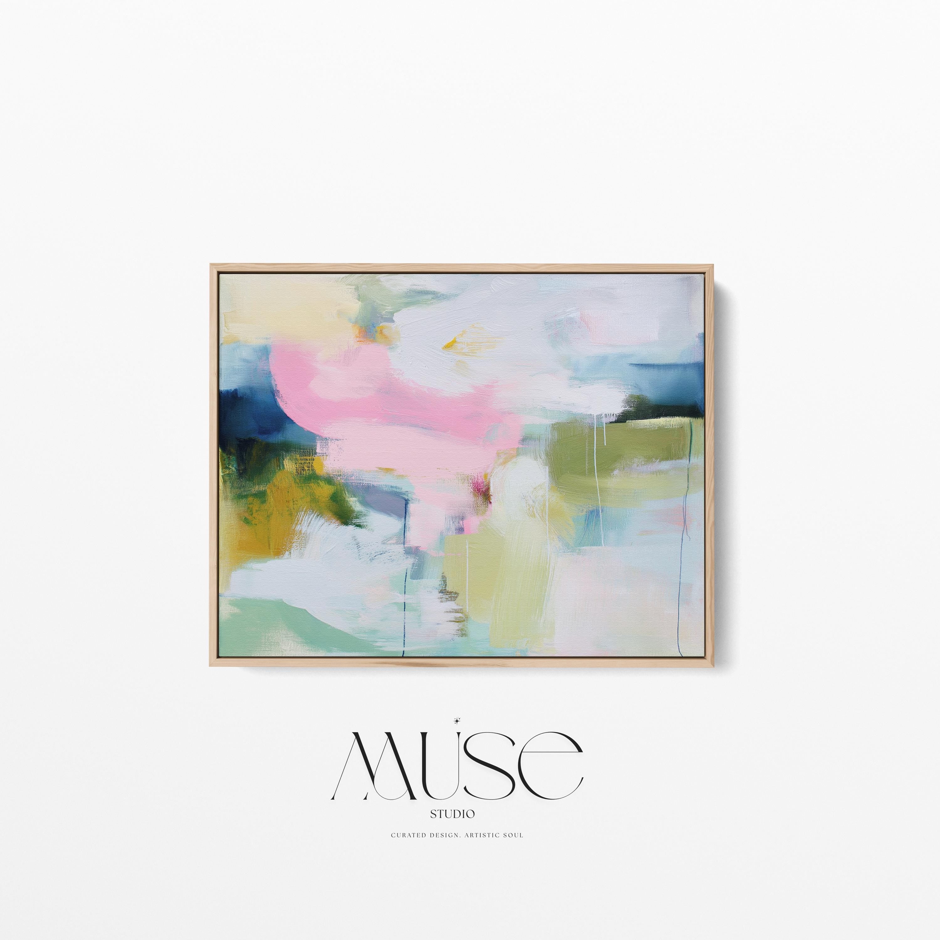 Muse Studio large framed canvas wall art featuring a soft pastel abstract composition in blush pink, olive, mint, mustard, and sky tones, printed with museum-grade giclée inks on premium artist canvas for living room decor.