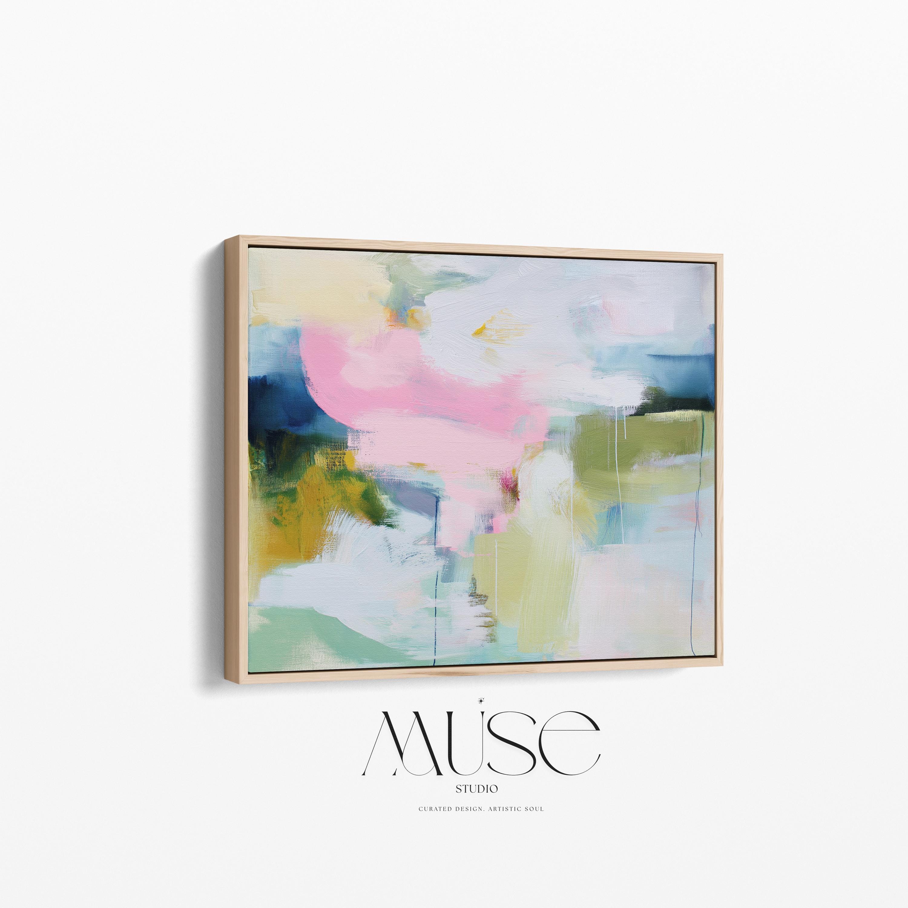 Muse Studio large framed canvas wall art featuring a soft pastel abstract composition in blush pink, olive, mint, mustard, and sky tones, printed with museum-grade giclée inks on premium artist canvas for living room decor.