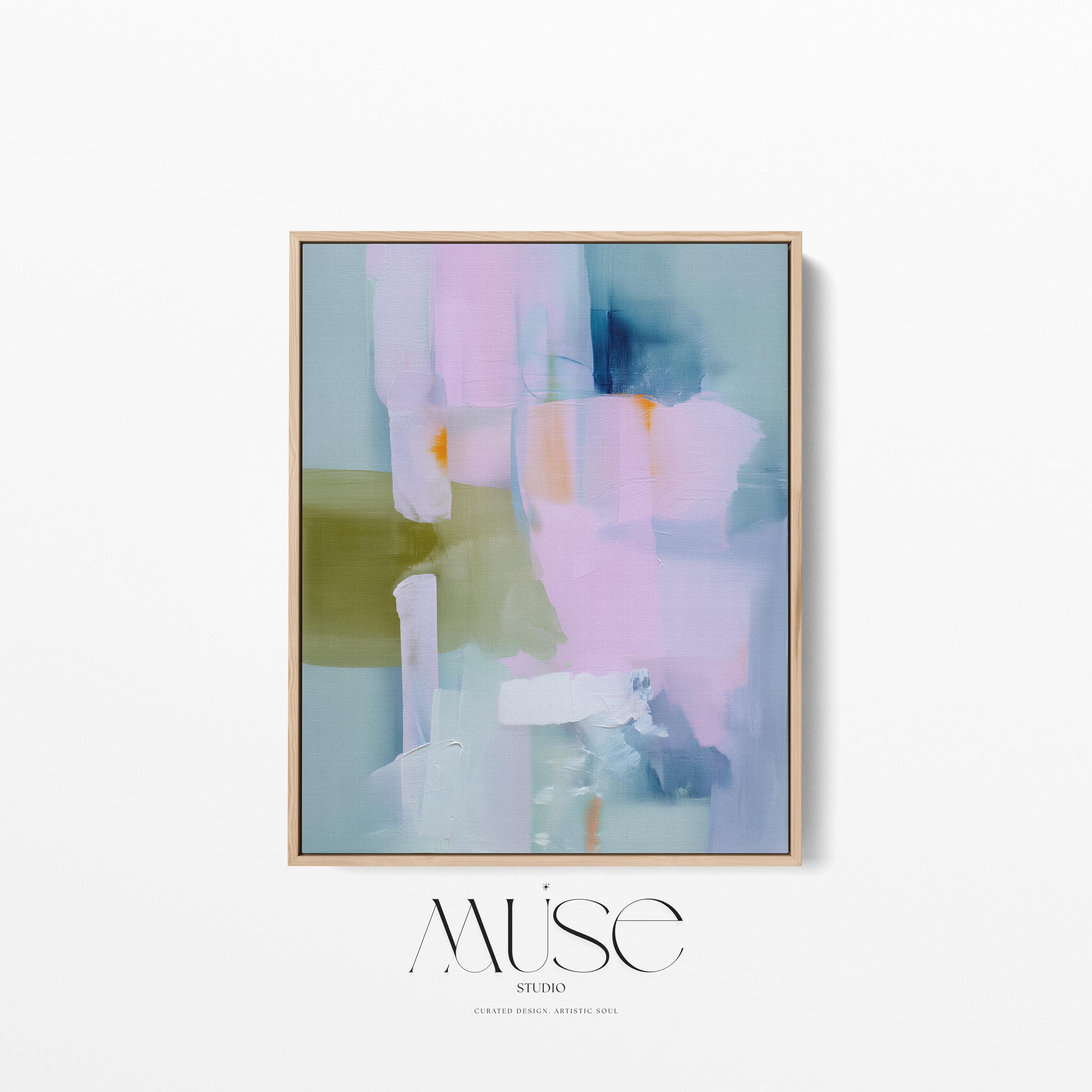 Muse Studio framed abstract wall art titled Soft Sonata 1043 in blush, sage, lilac, and misted blue, printed with museum-grade giclée inks on premium gallery-wrapped canvas in a natural wood float frame, styled vertically in a serene organic transitional bedroom and spa-inspired bathroom with warm oak and soft neutral textiles.