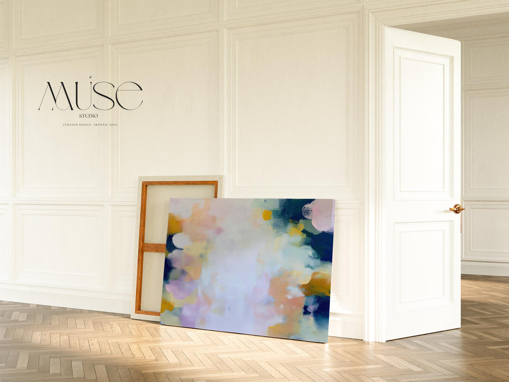 Muse Studio large horizontal abstract canvas wall art printed with museum-grade giclée inks on premium gallery-wrapped canvas, featuring blush and navy pastel tones in an Organic Transitional style, styled above a bed in a serene coastal bedroom.