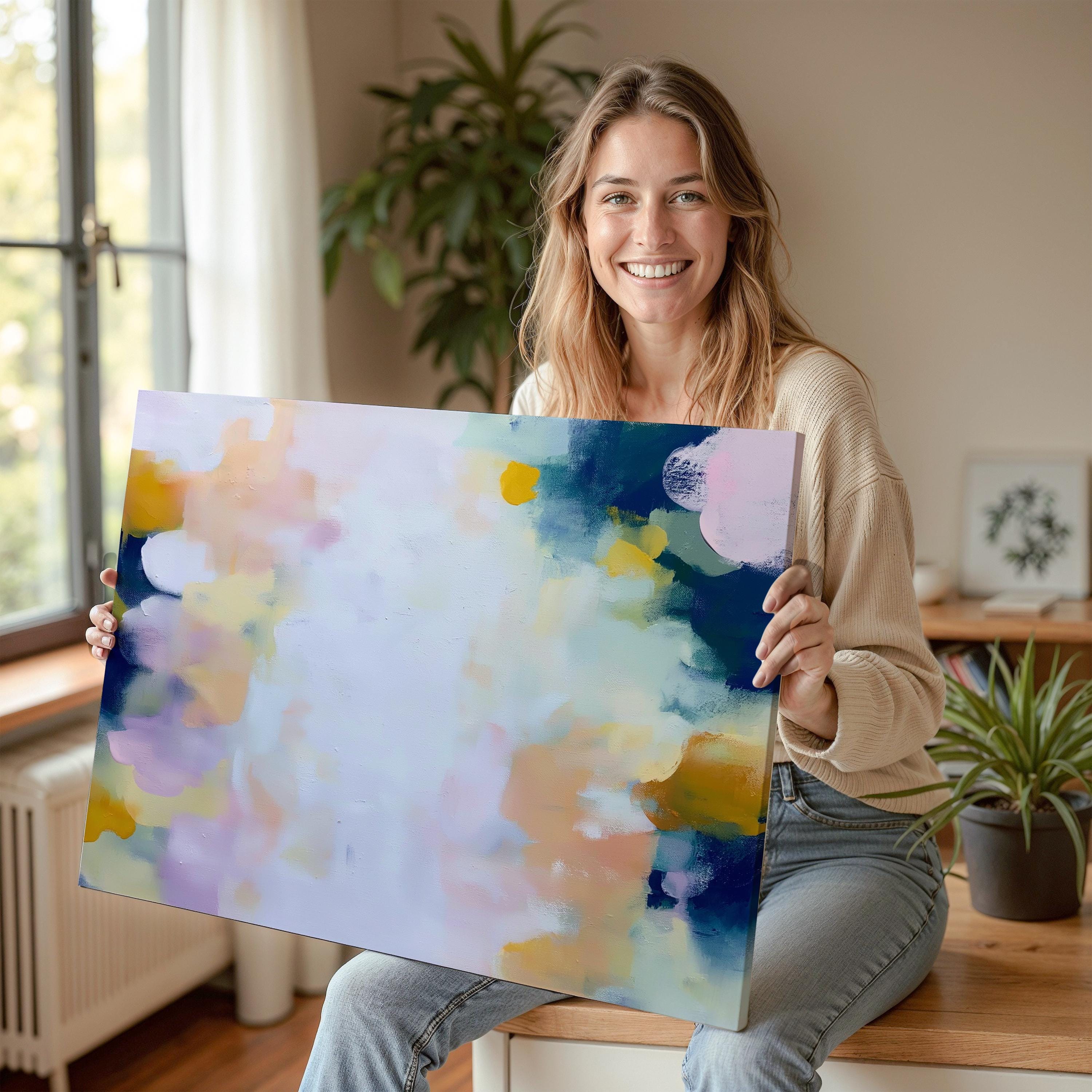Muse Studio large horizontal abstract canvas wall art printed with museum-grade giclée inks on premium gallery-wrapped canvas, featuring blush and navy pastel tones in an Organic Transitional style, styled above a bed in a serene coastal bedroom.