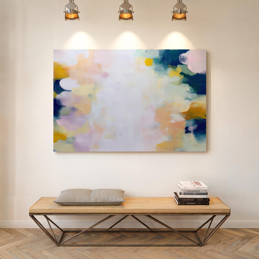 Muse Studio large horizontal abstract canvas wall art printed with museum-grade giclée inks on premium gallery-wrapped canvas, featuring blush and navy pastel tones in an Organic Transitional style, styled above a bed in a serene coastal bedroom.