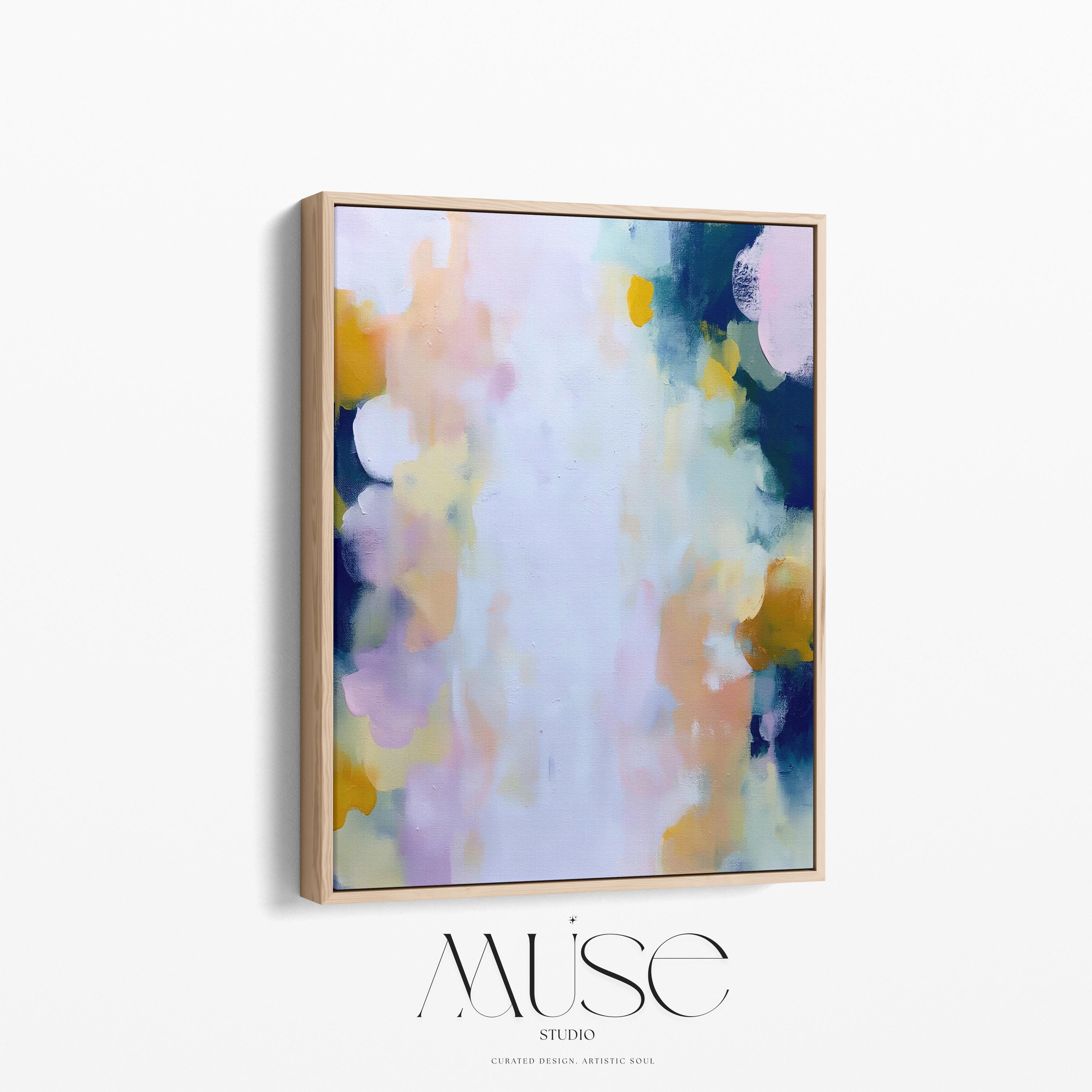 Muse Studio large vertical abstract canvas wall art printed with museum-grade giclée inks on premium gallery-wrapped canvas, featuring blush and navy pastel tones in an Organic Transitional style, styled above a dresser in a serene coastal bedroom.