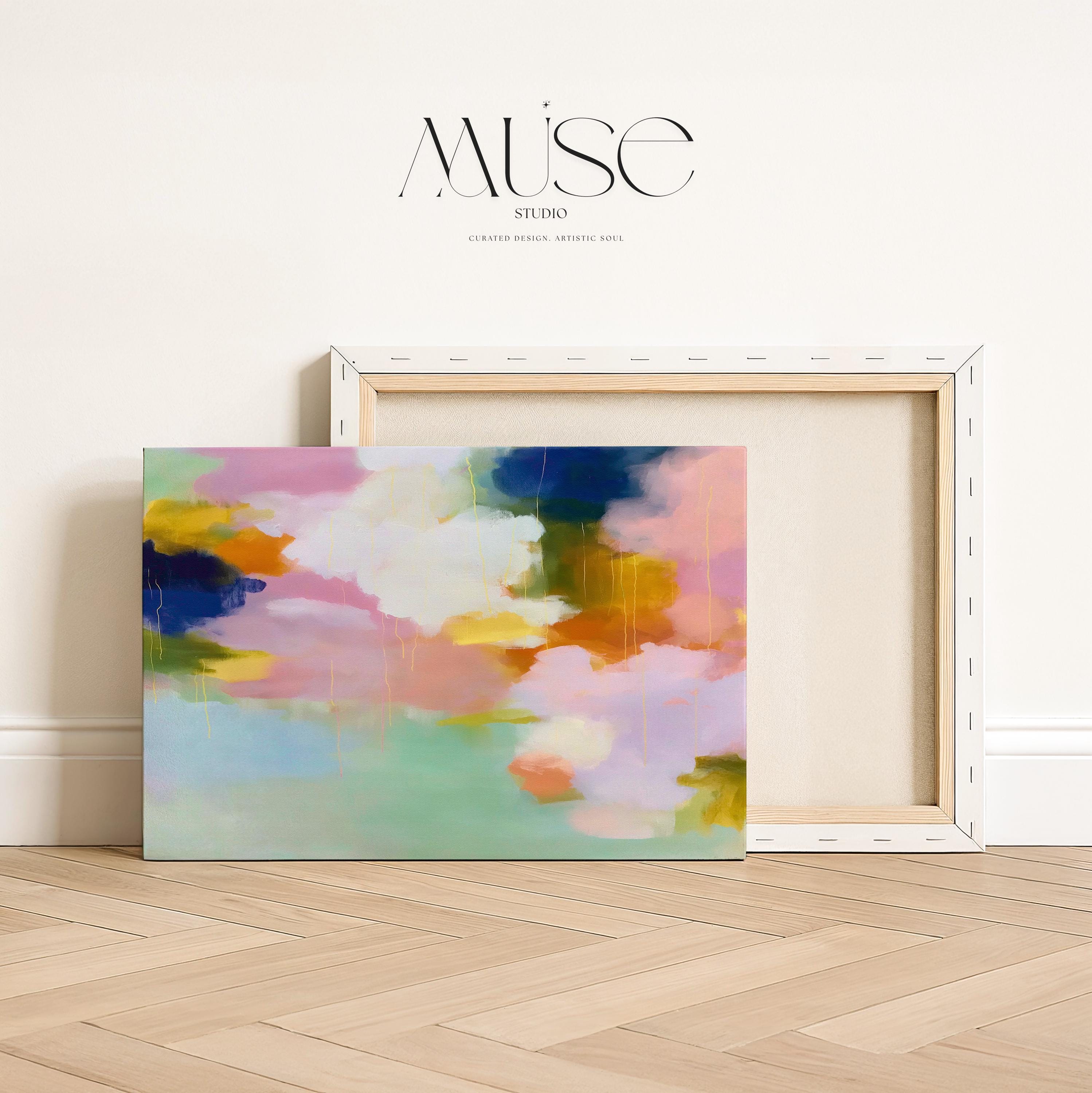 Muse Studio large horizontal abstract canvas wall art printed with museum-grade giclée inks on premium gallery-wrapped canvas, featuring blush, citrus, and navy pastel tones in a Soft Contemporary Pastel style, styled above a linen sofa in a coastal living room.