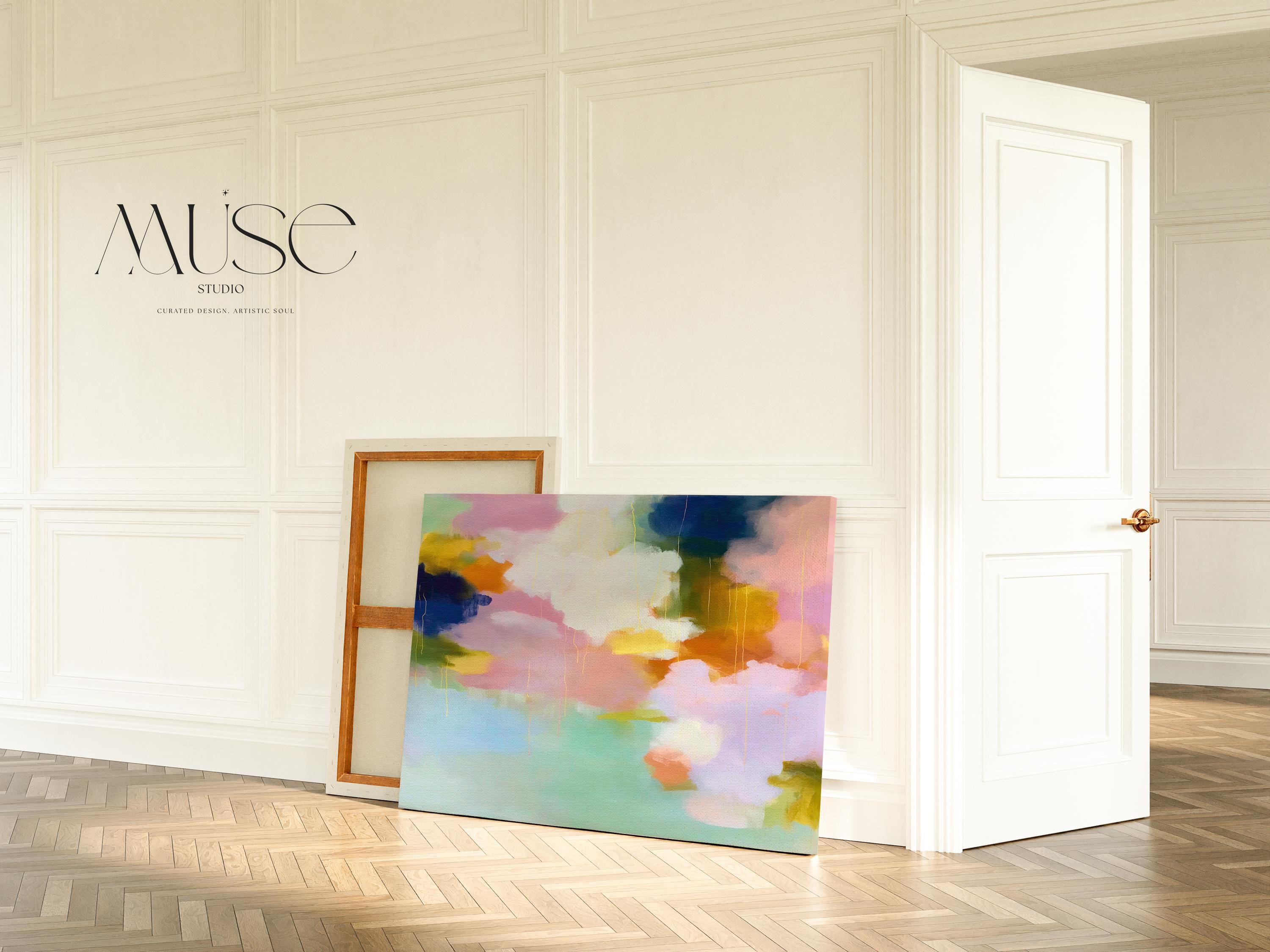 Muse Studio large horizontal abstract canvas wall art printed with museum-grade giclée inks on premium gallery-wrapped canvas, featuring blush, citrus, and navy pastel tones in a Soft Contemporary Pastel style, styled above a linen sofa in a coastal living room.