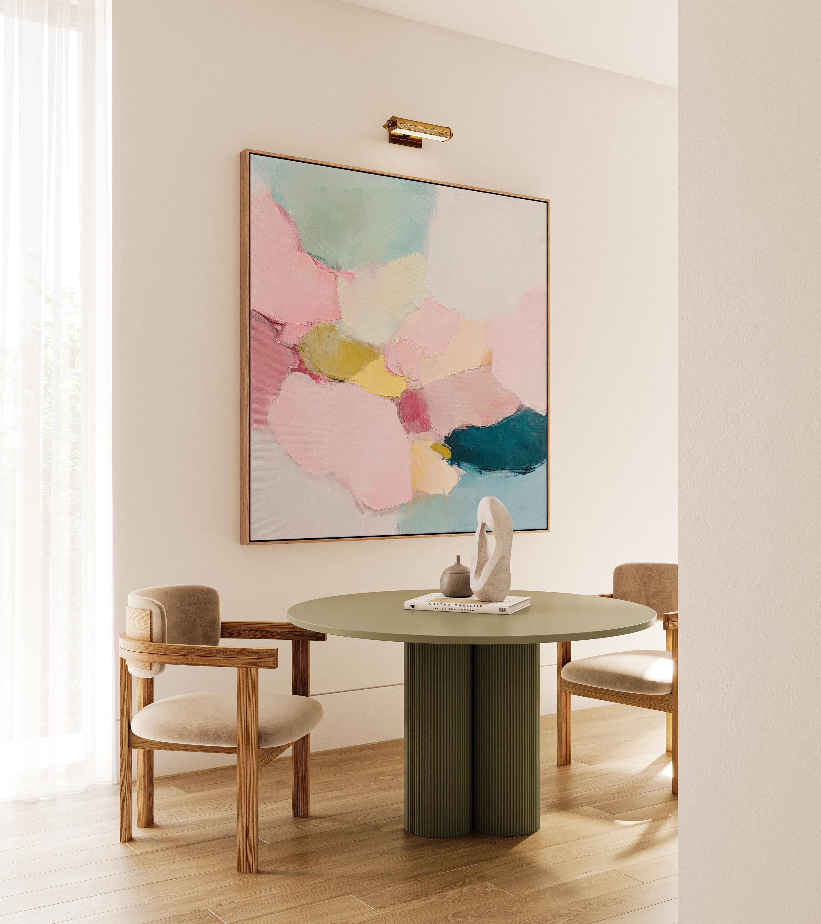 Large square abstract framed canvas wall art featuring soft blush pink, muted teal, pale aqua blue, and butter yellow painterly shapes with visible texture, styled in a modern neutral living room, offering calm color contrast and quiet luxury for above sofa or bedroom wall placement.