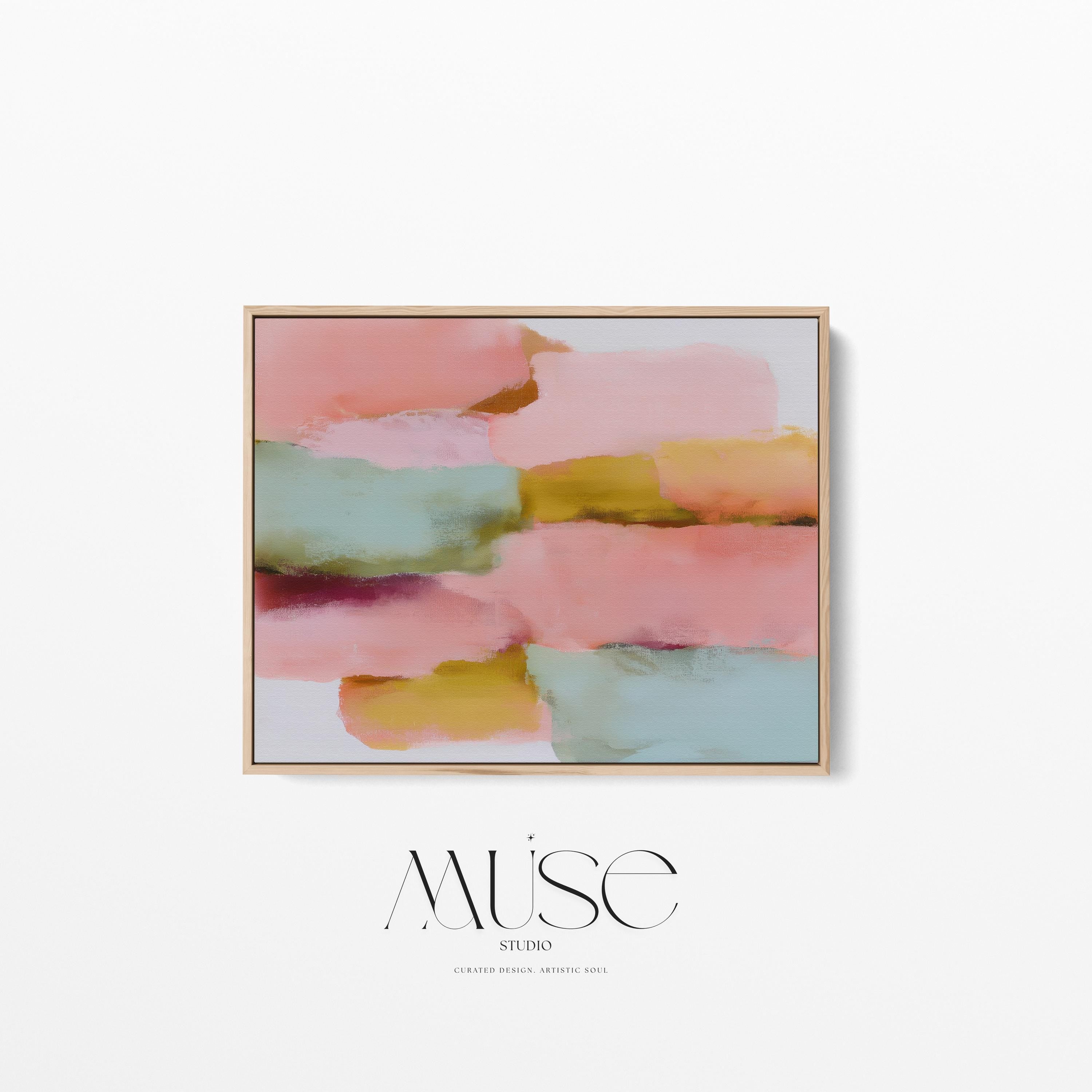 Large horizontal abstract framed canvas wall art featuring blush pink, coral, muted aqua blue, golden ochre, and plum layered brushstrokes, styled above a neutral sofa in a modern living room, offering warm contemporary color and balanced movement for oversized wall placement.