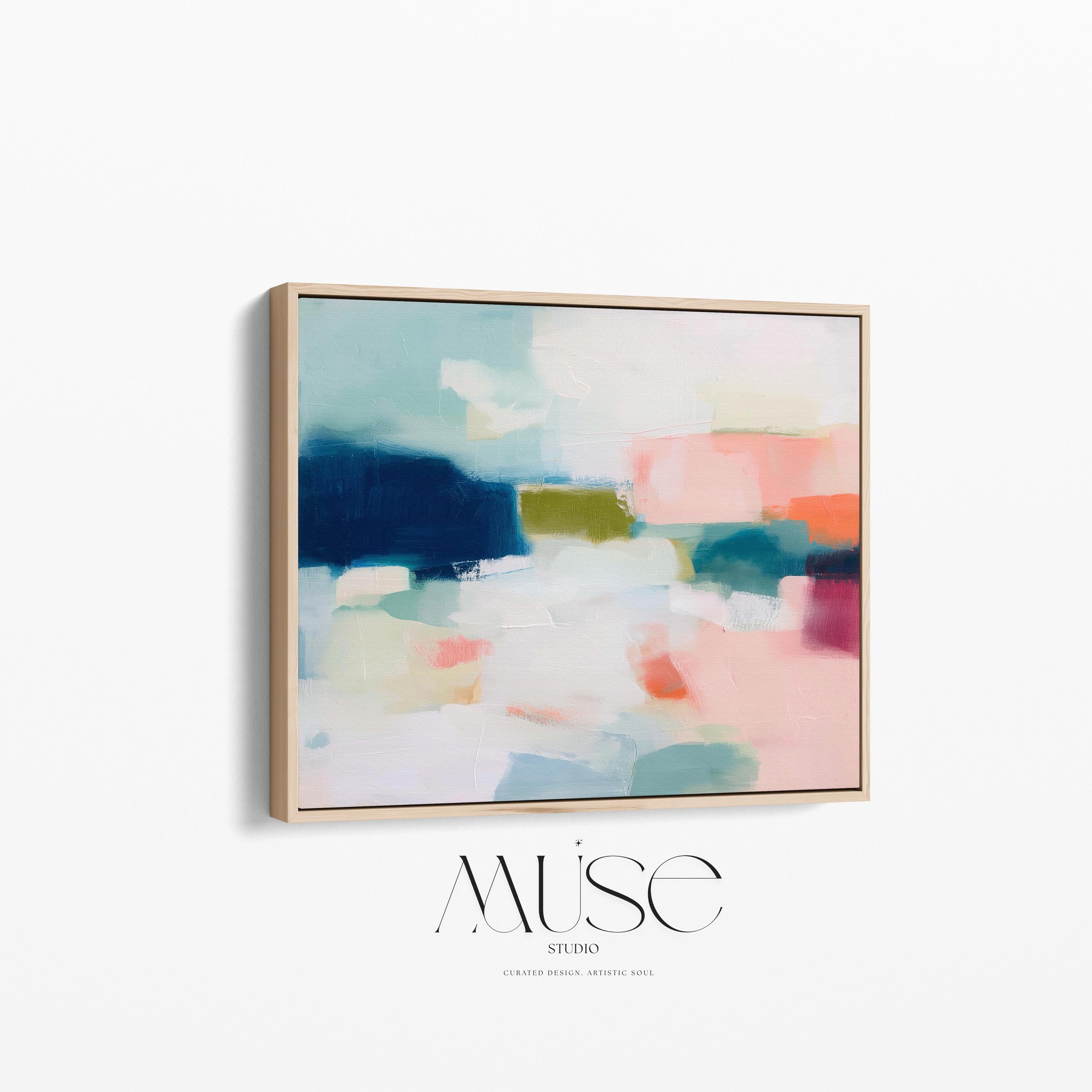 Large horizontal abstract framed canvas wall art featuring deep navy blue, muted aqua, soft blush pink, olive green, coral accents, and layered white brushstrokes, styled above a neutral sofa in a modern coastal living room, offering balanced contrast and refined contemporary color.