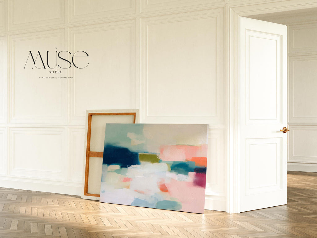 Large horizontal abstract canvas wall art featuring navy blue, muted aqua, blush pink, olive green, and coral tones layered across a soft white background, designed for above couch placement in a modern coastal living room, offering rich contrast and contemporary warmth.