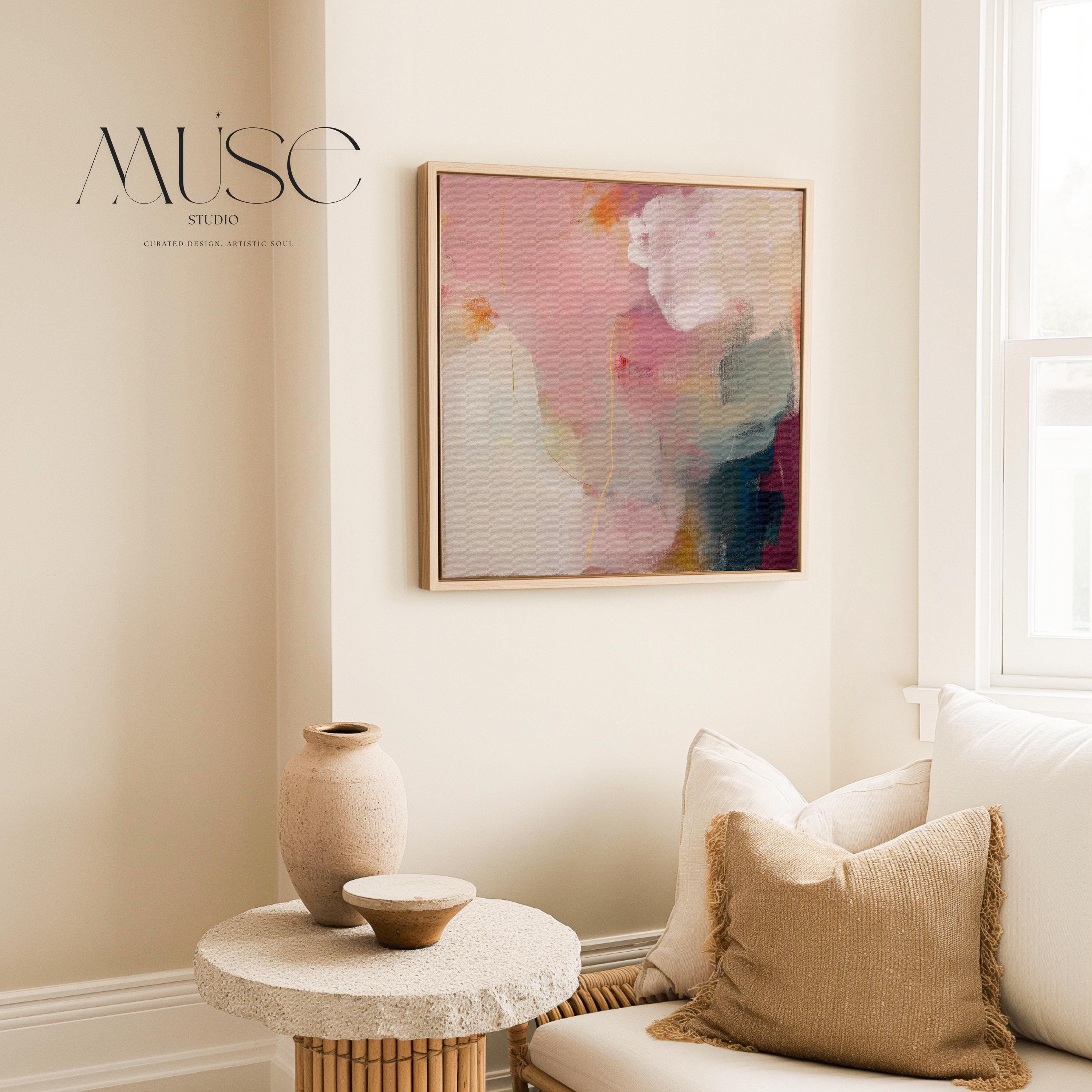 Large square abstract wall art in blush pink, warm cream, muted coral, and deep plum tones, printed as gallery-wrapped large canvas wall art, styled above a neutral sofa to create a romantic, painterly focal point for living rooms or bedrooms.