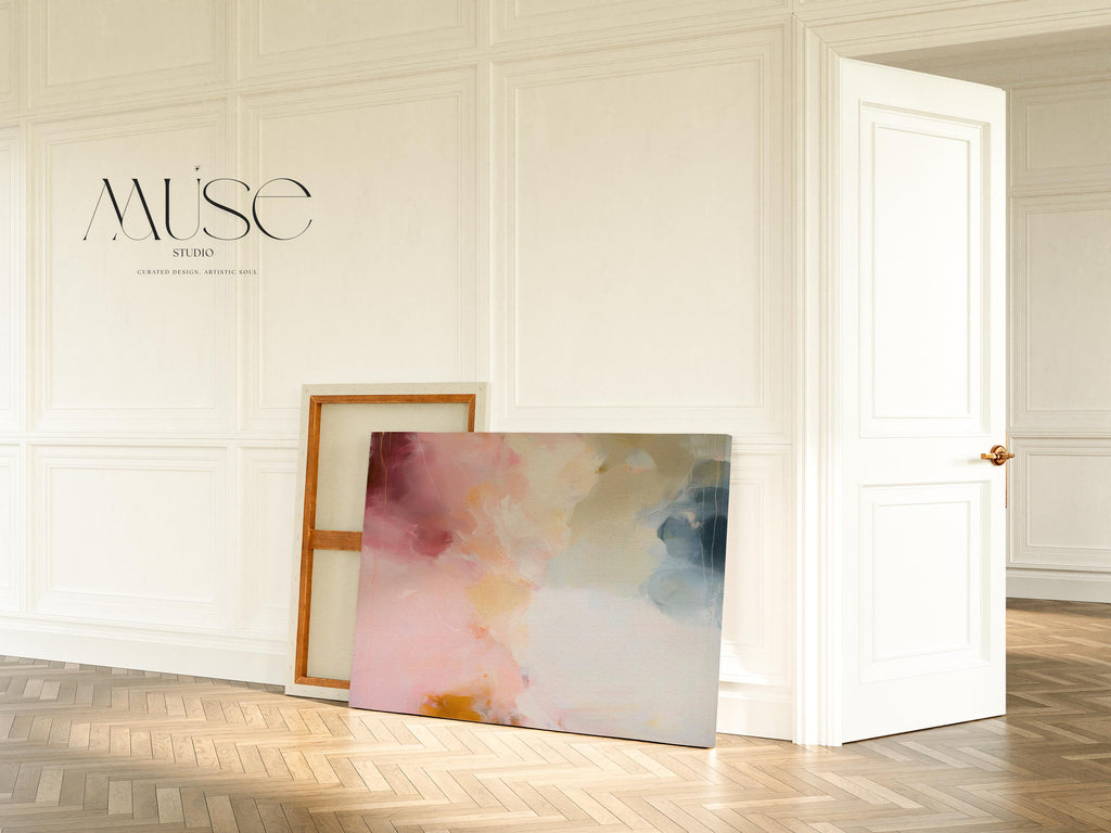 Large horizontal abstract wall art in blush pink, coral, cream, and muted blue-grey tones printed as large canvas wall art, styled above a neutral sofa to create a romantic contemporary focal point.