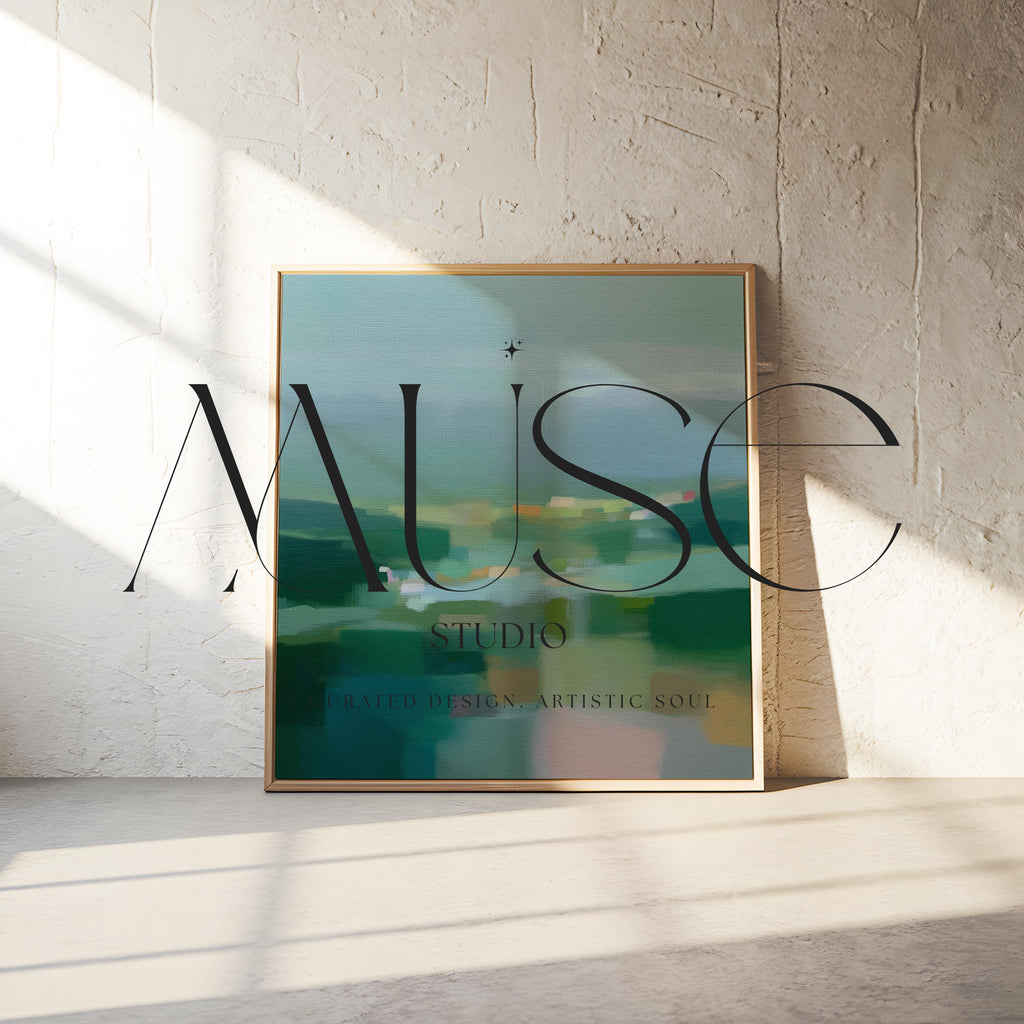 Large square framed canvas wall art in layered sage, deep green, and misty blue tones styled against a light neutral wall, creating a calm nature-inspired focal point in a refined interior.