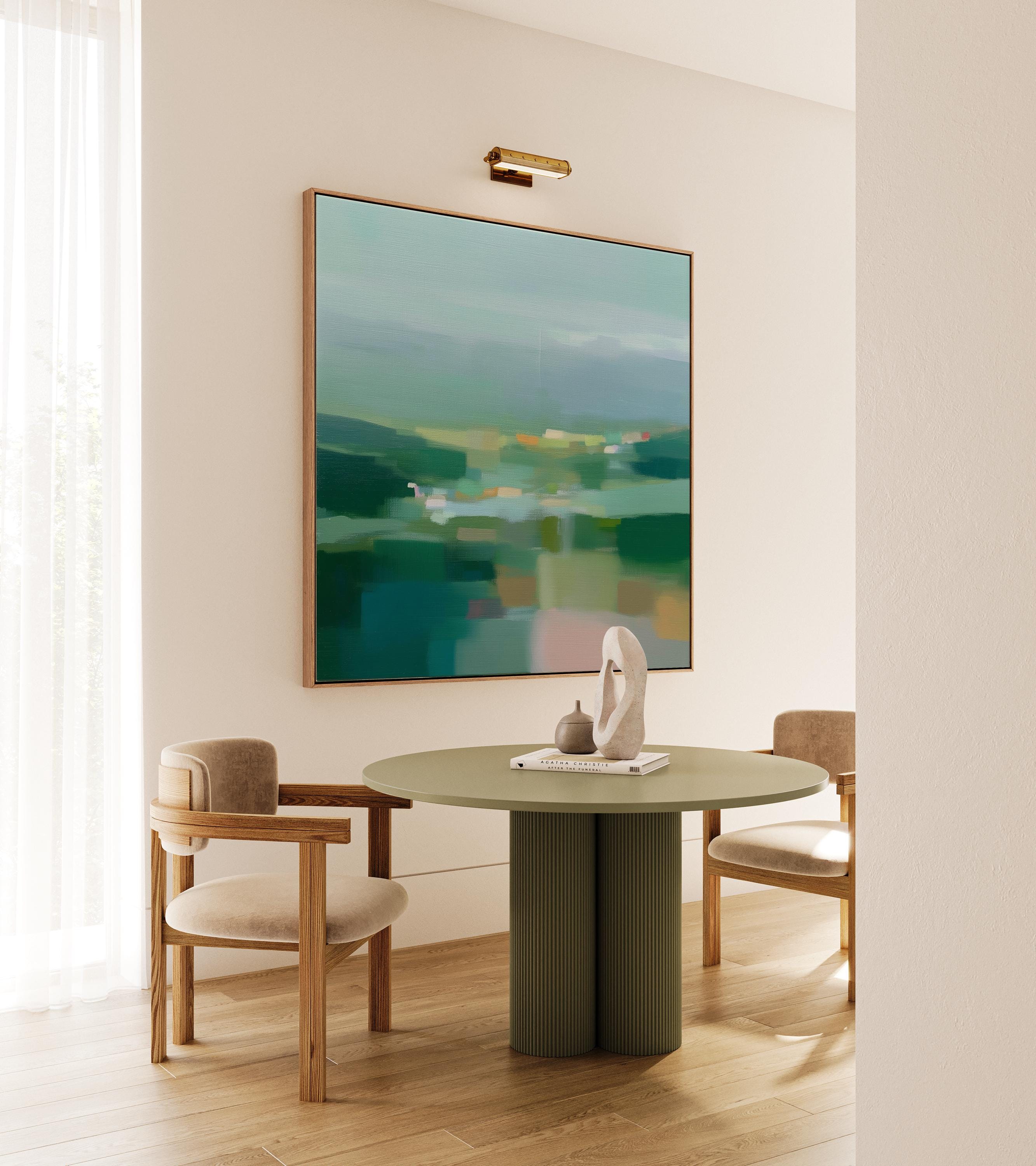 Large square framed canvas wall art in layered sage, deep green, and misty blue tones styled against a light neutral wall, creating a calm nature-inspired focal point in a refined interior.