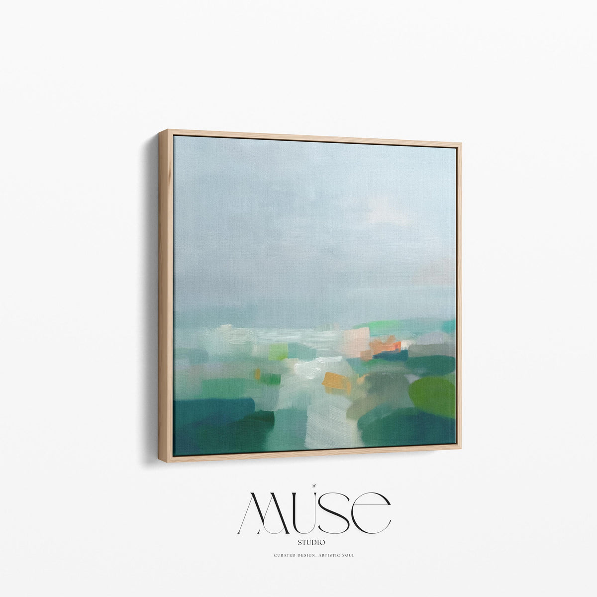 Large square framed canvas wall art in sage green, soft blue, and muted cream tones styled in a warm neutral farmhouse interior, creating a calm countryside-inspired focal point with soft horizon depth.
