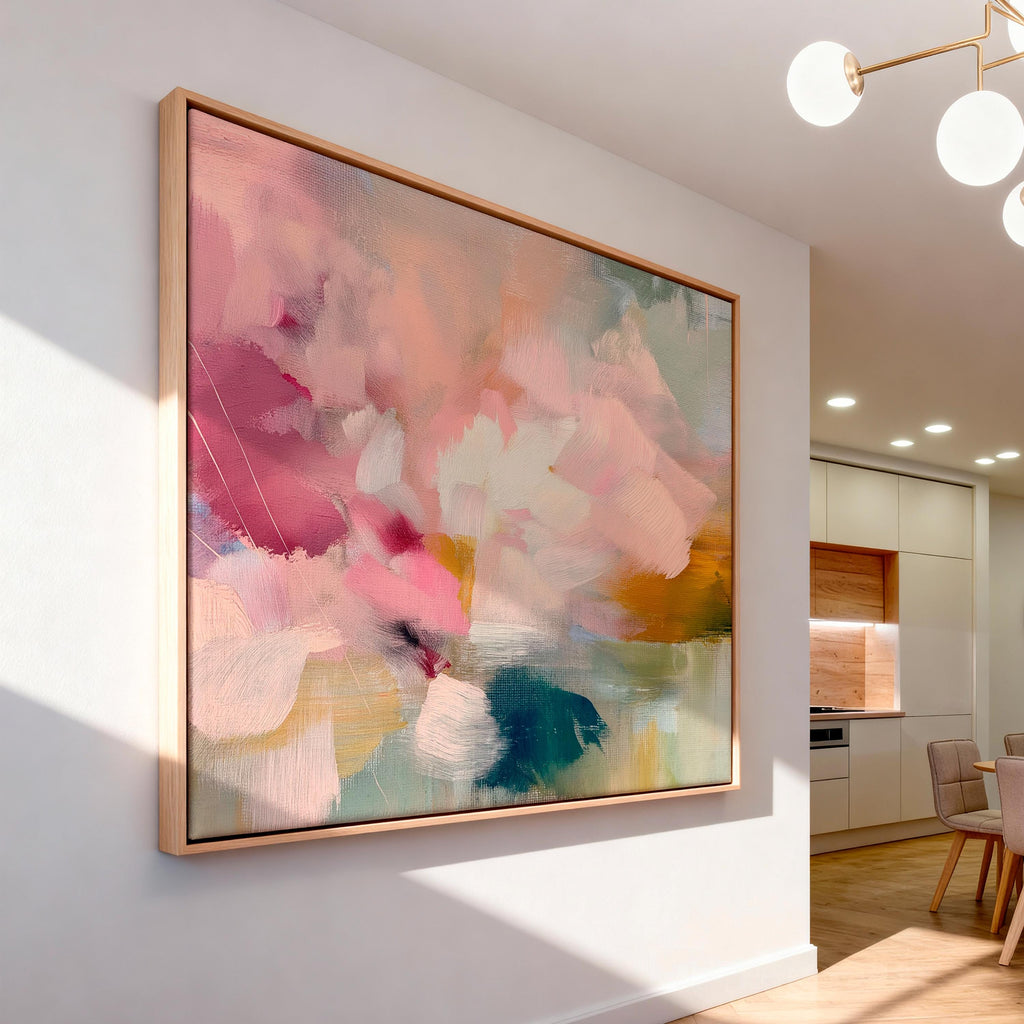 Soft blush, coral, teal and cream floral abstract framed canvas wall art by Muse Studio & Co. in a natural wood floating frame, styled as a calming focal piece in a warm contemporary living space.